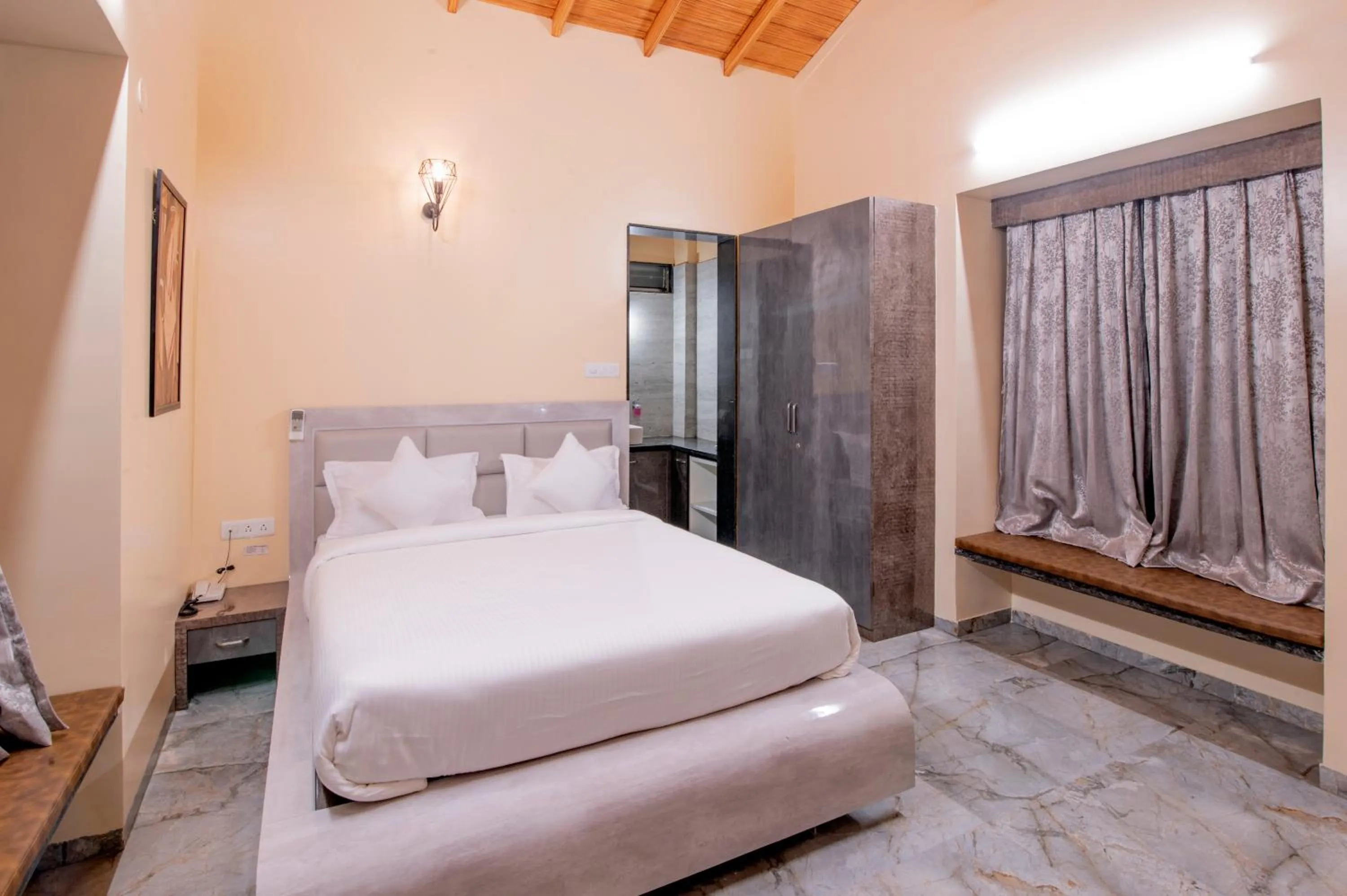 Bed in Freesia Resort by Express Inn