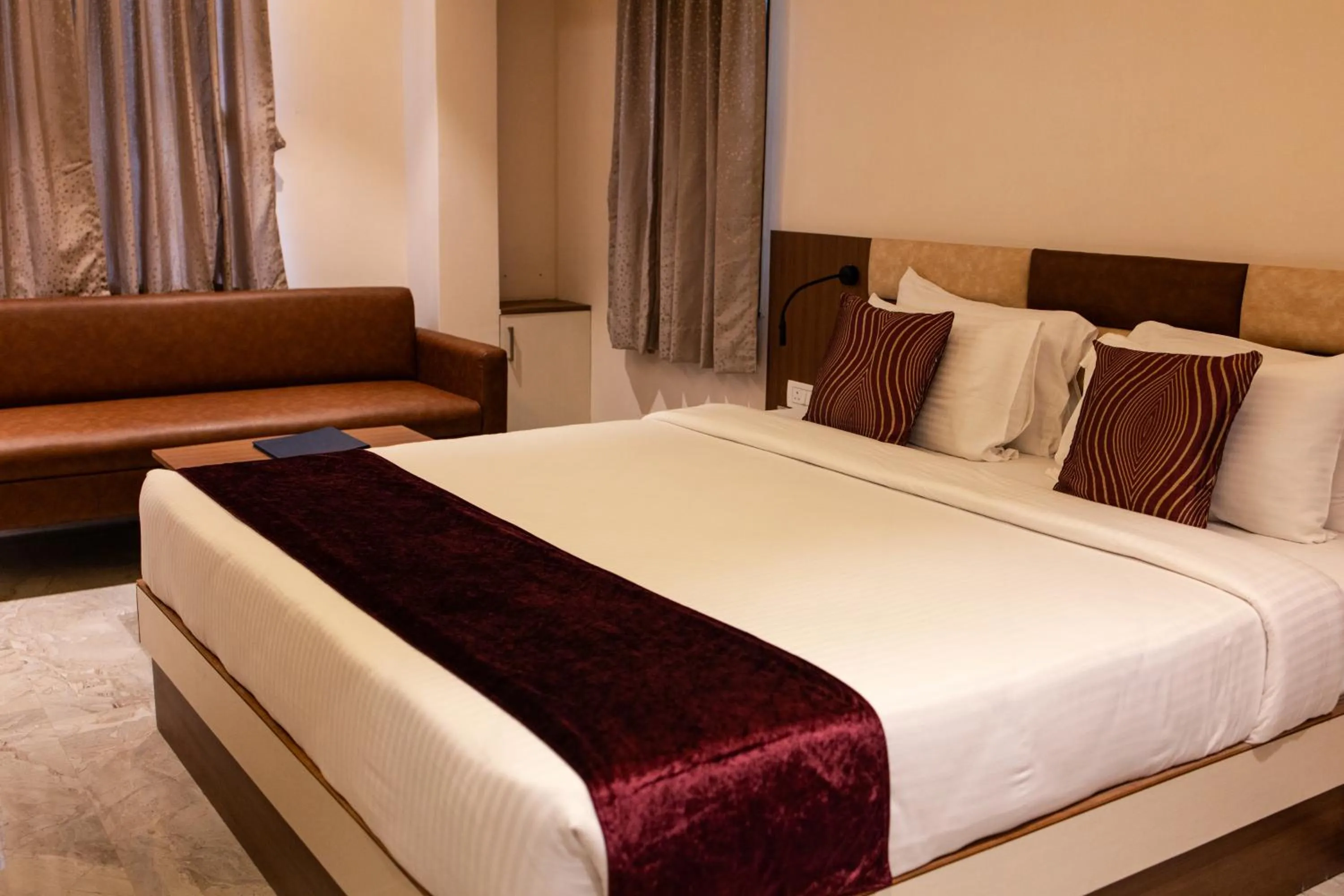 Bed in Freesia Resort by Express Inn