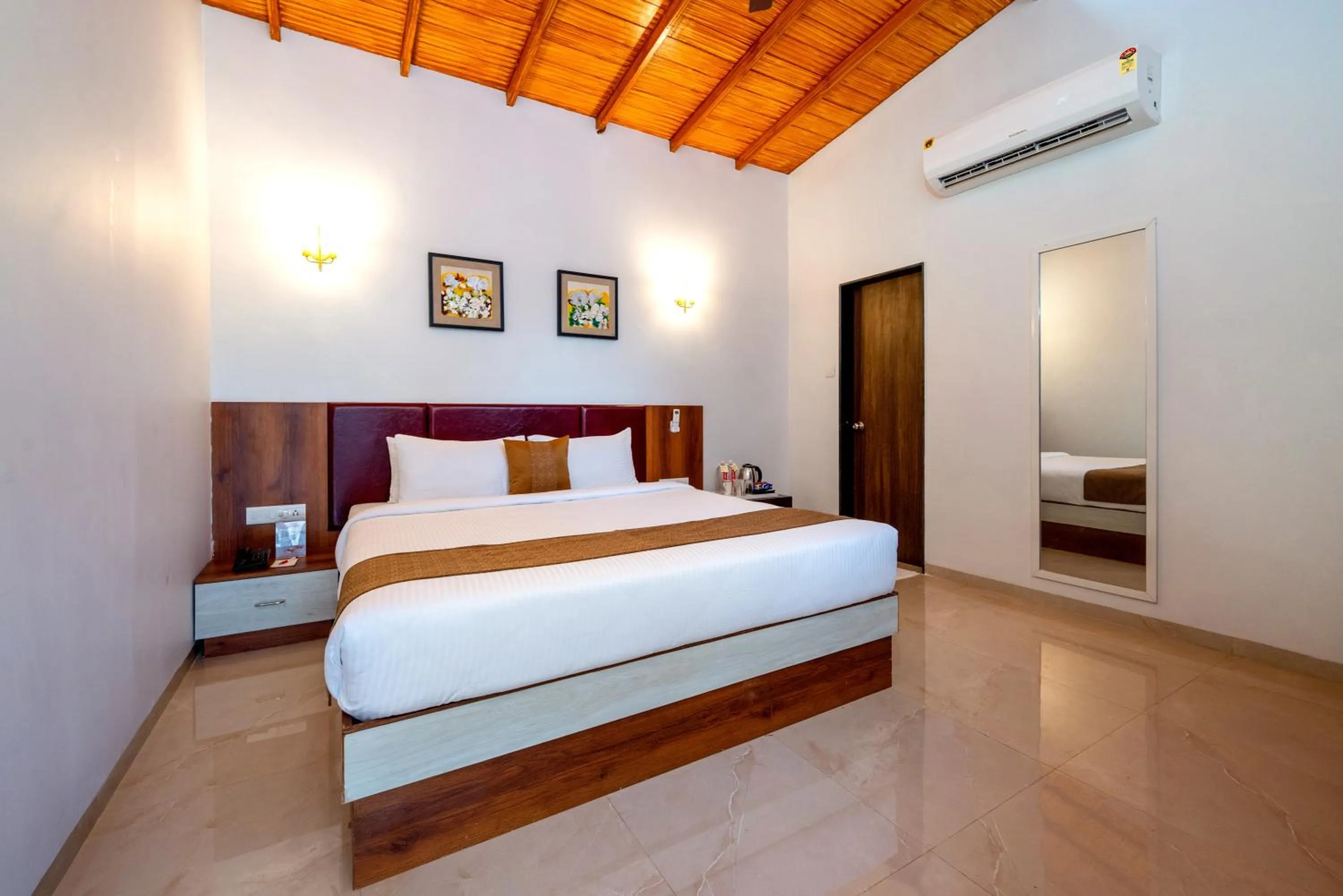 Bed in Freesia Resort by Express Inn
