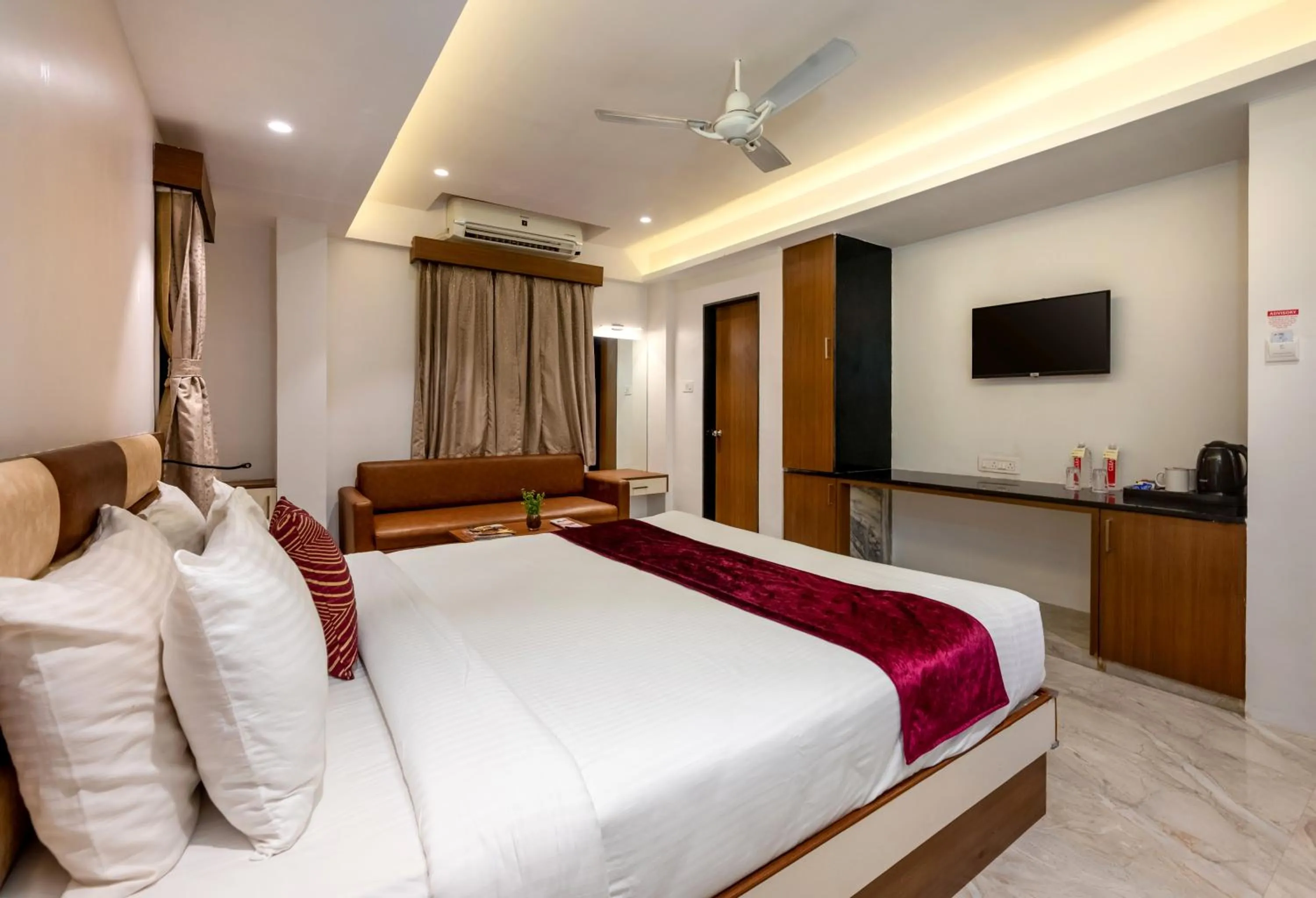 Bed in Freesia Resort by Express Inn