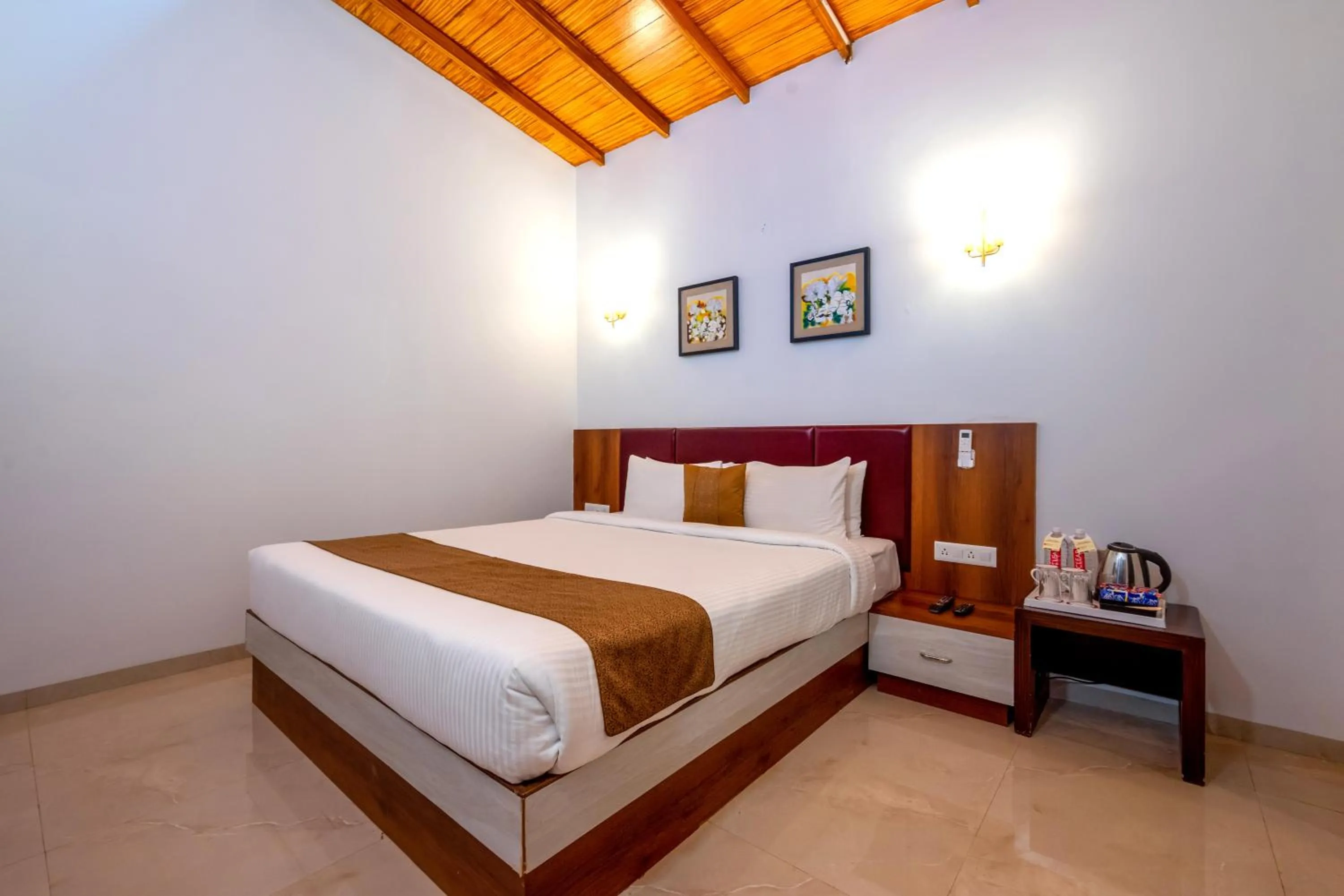 Bed in Freesia Resort by Express Inn
