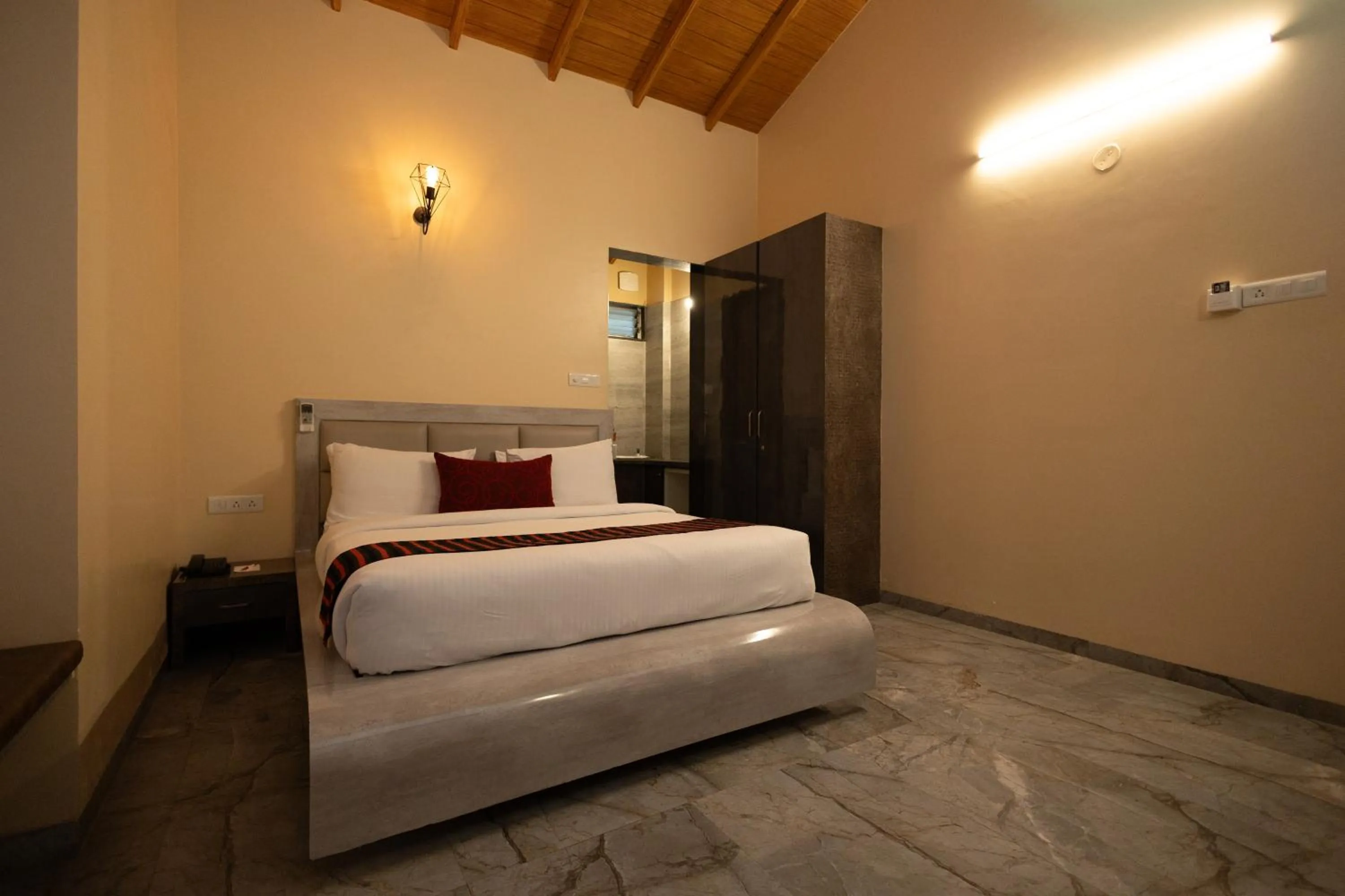 Bed in Freesia Resort by Express Inn