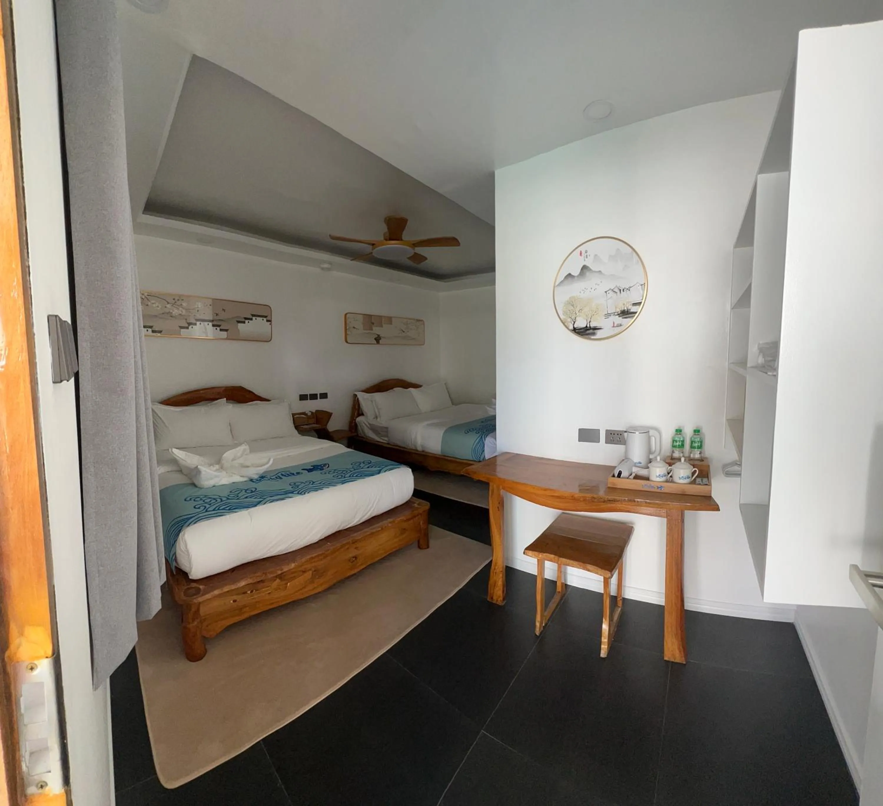 Bed in Lucky Tito PG Dive Resort