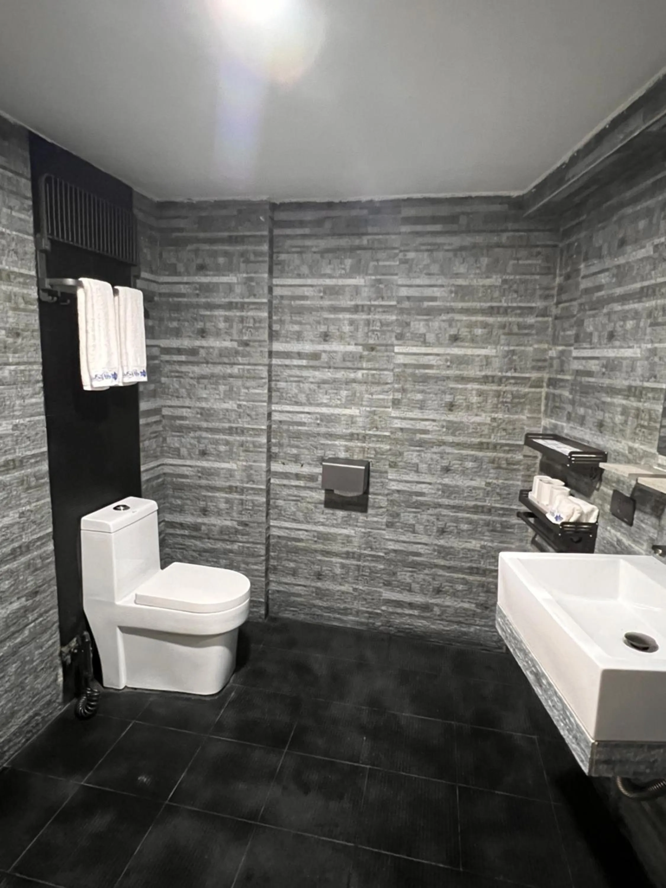 Toilet in Lucky Tito PG Dive Resort