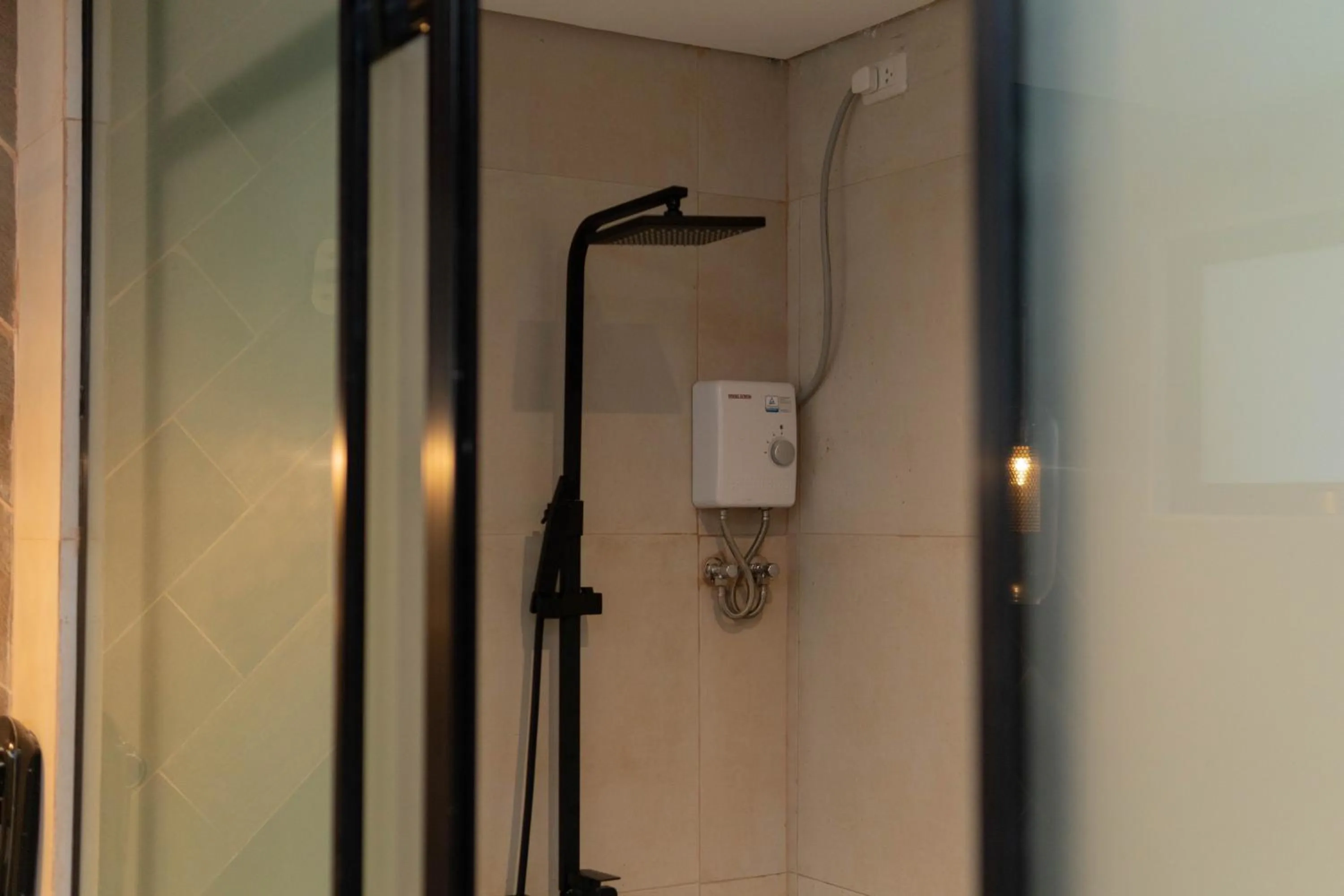 Shower in Adelina Hotel and Suites