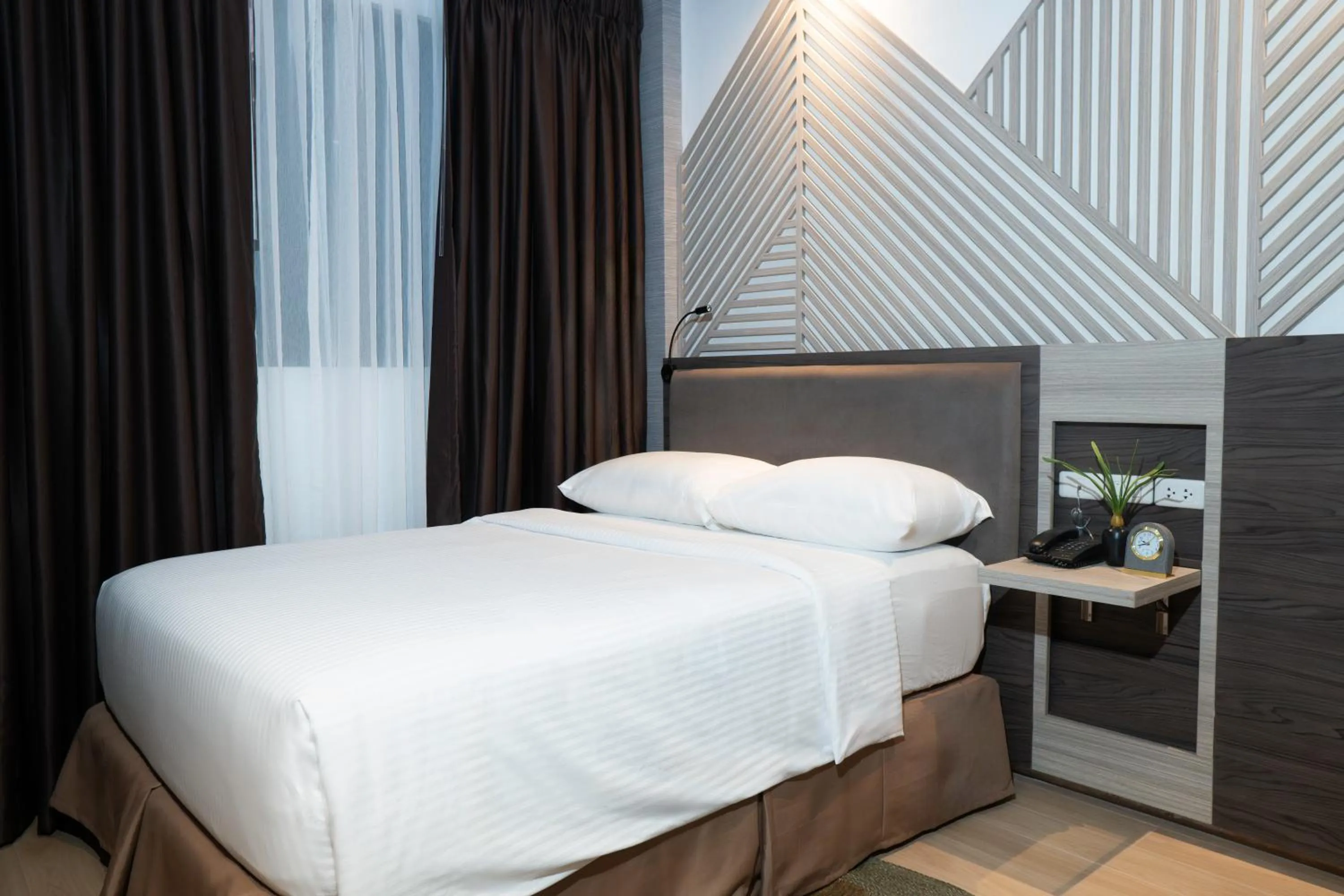 Bed in Adelina Hotel and Suites
