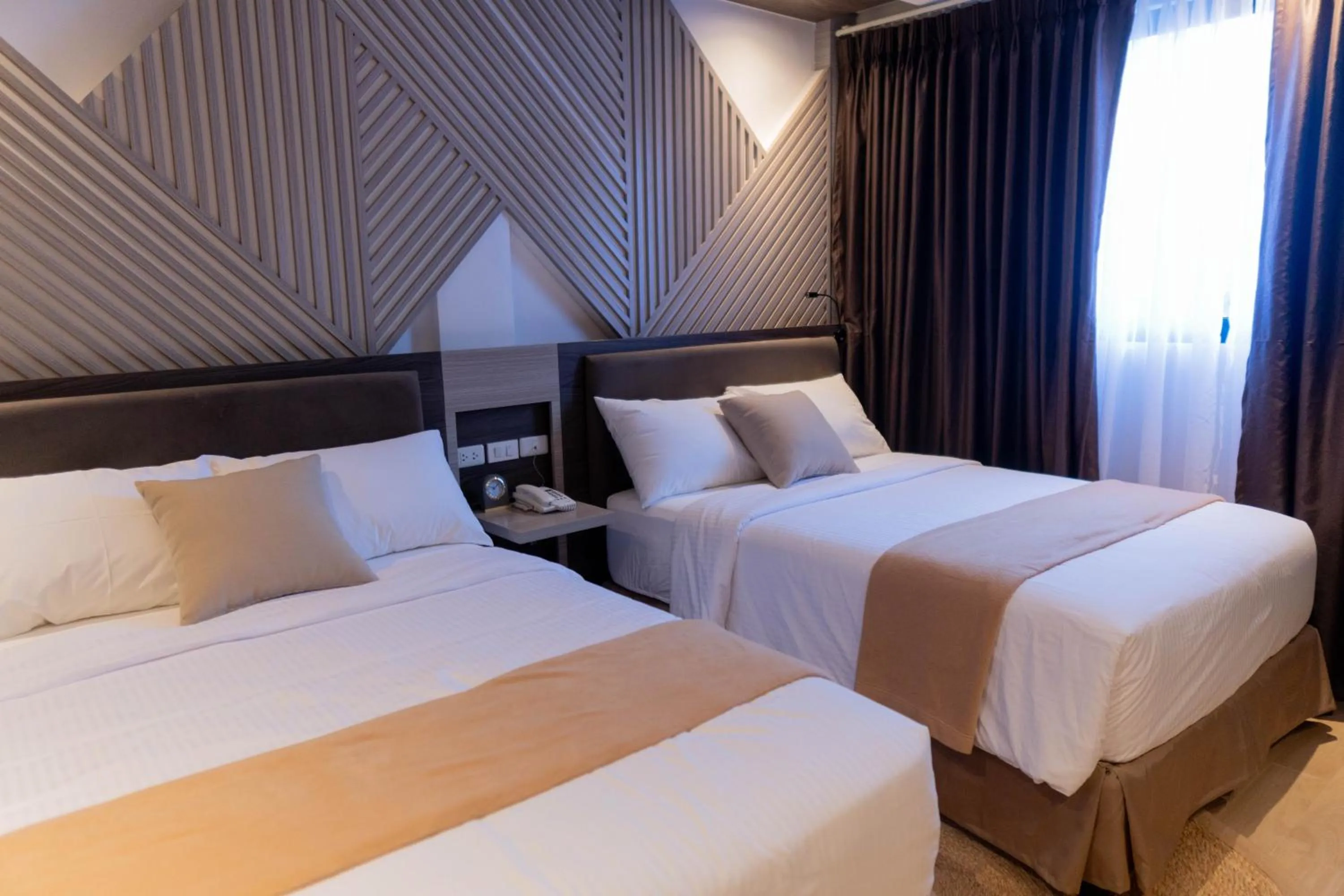 Bed in Adelina Hotel and Suites