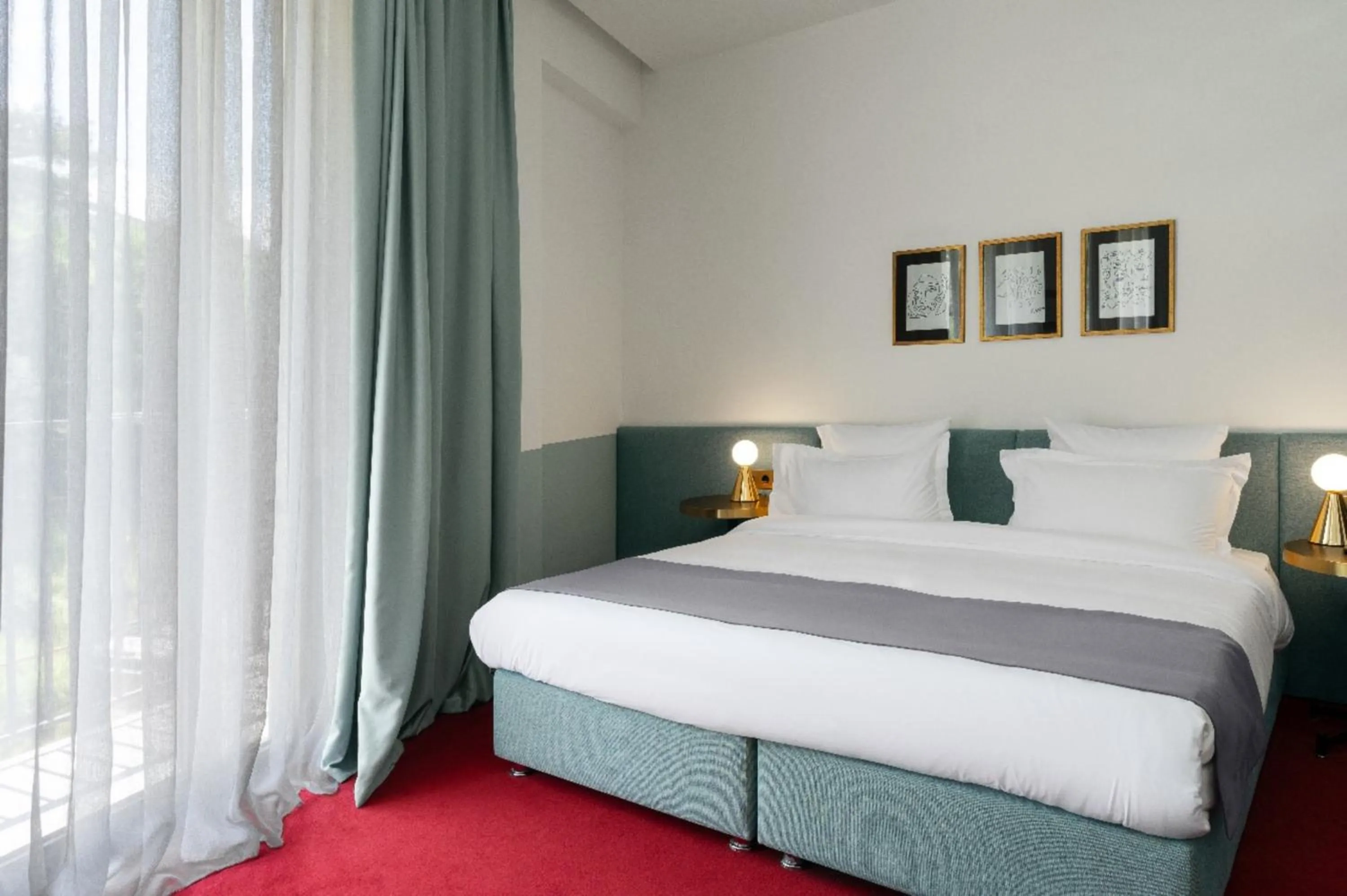 Bed in Castor & Pollux Hotel