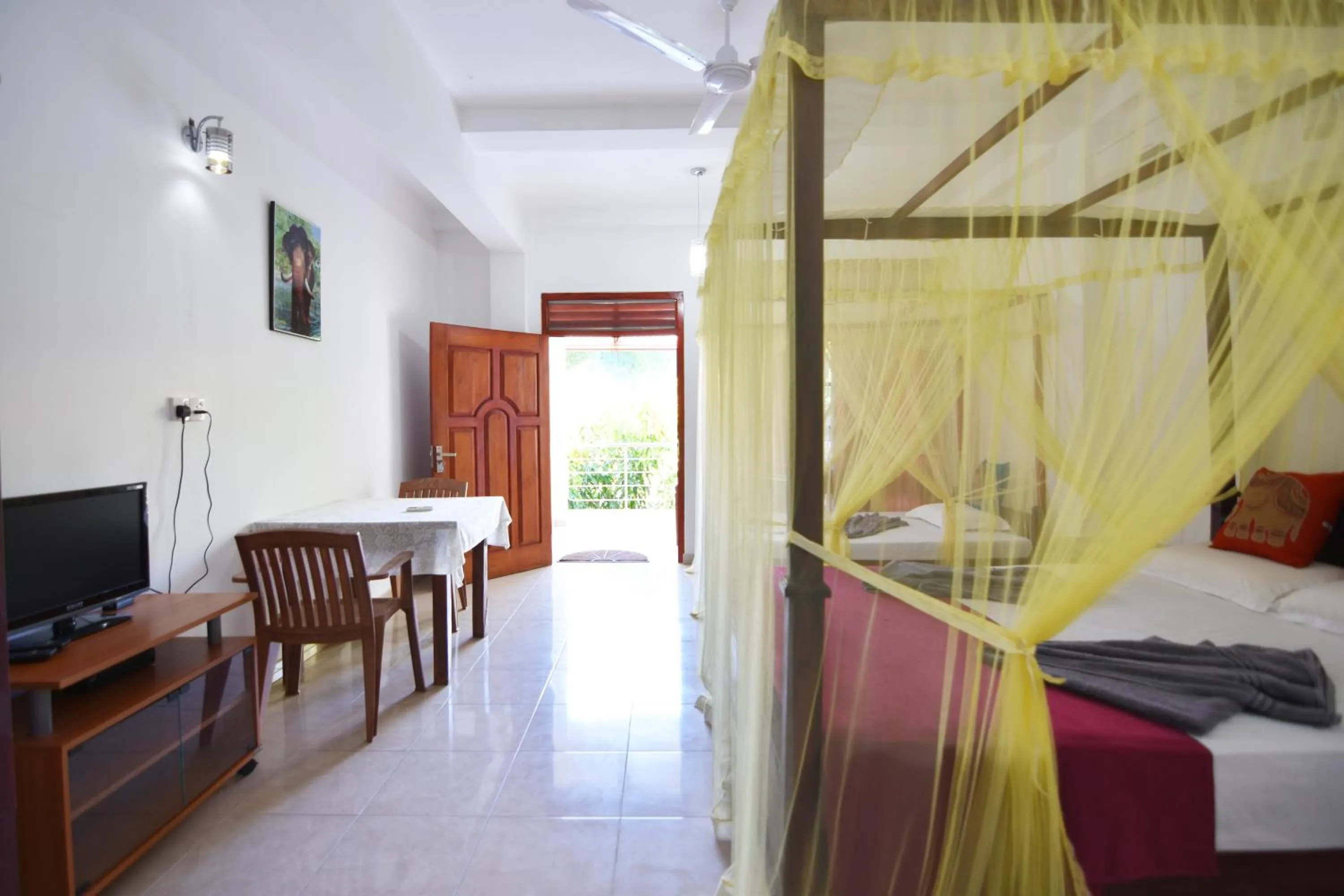 Toilet, Bed in The Lodge Unawatuna