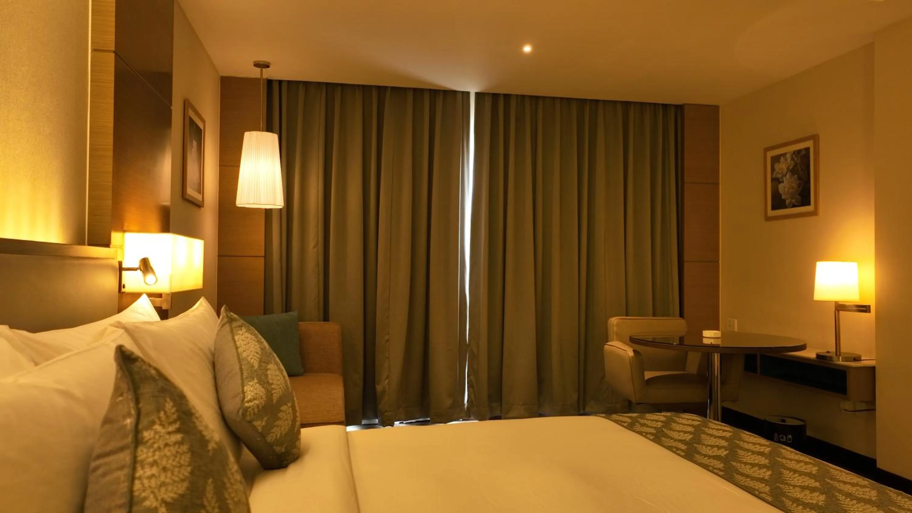 Bedroom, Bed in Gokulam Grand Trivandrum