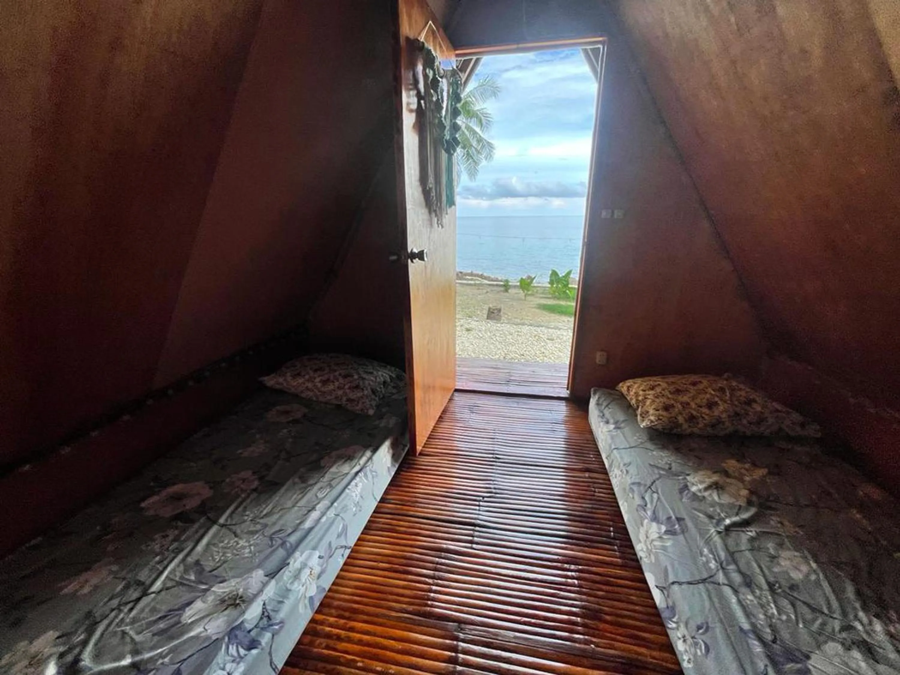 Bed in Hagdan Reef Dive Spot by HiveRooms