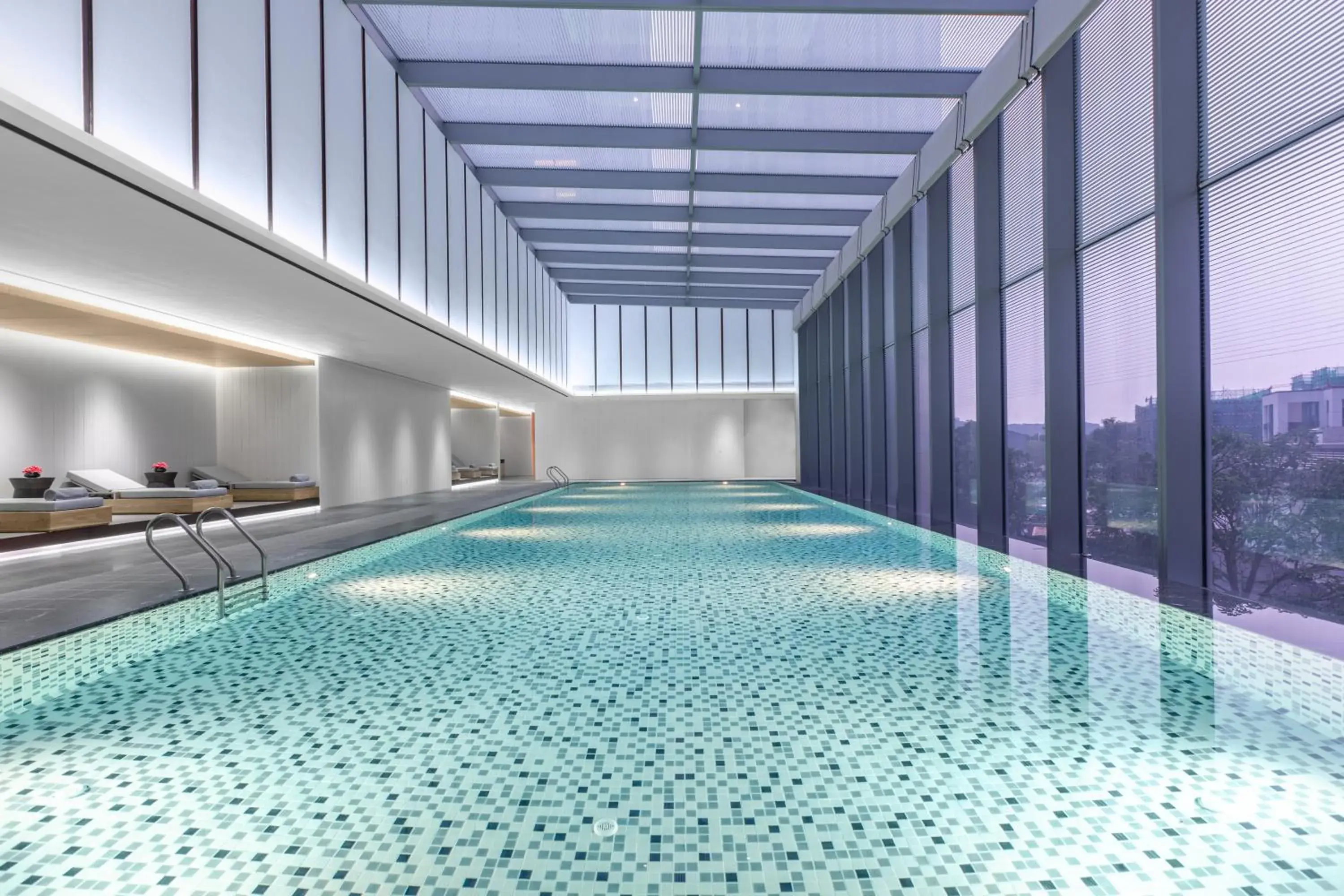 Swimming pool in Crowne Plaza Jiangmen Binjiang by IHG Swimming pool in Crowne Plaza Jiangmen Binjiang by IHG