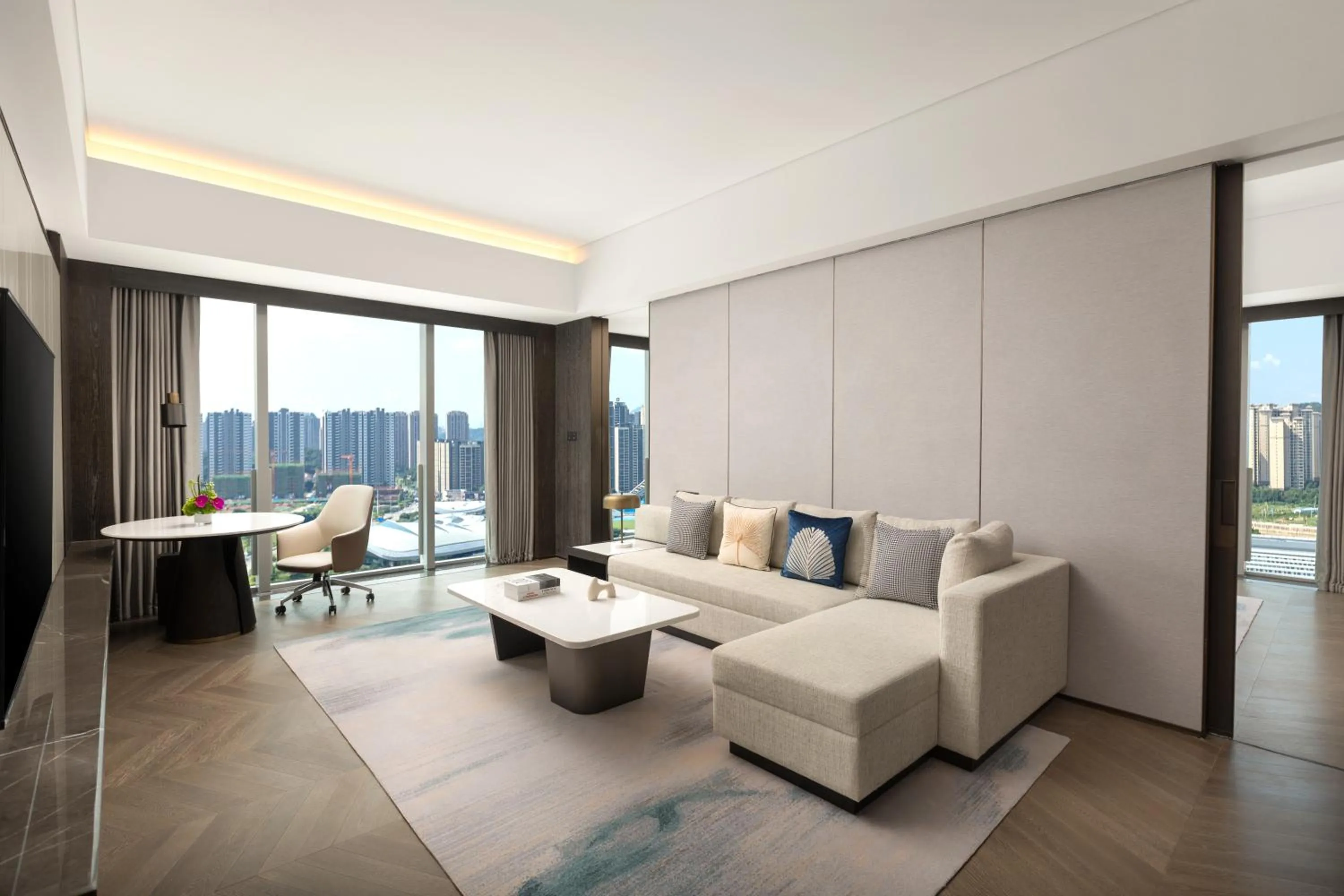 Living room in Crowne Plaza Jiangmen Binjiang by IHG