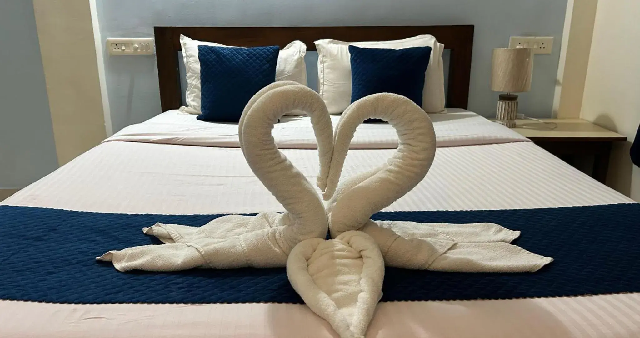 Decorative detail, Bed in Aqua Wave by YogiTree Hotels Decorative detail, Bed in Aqua Wave by YogiTree Hotels