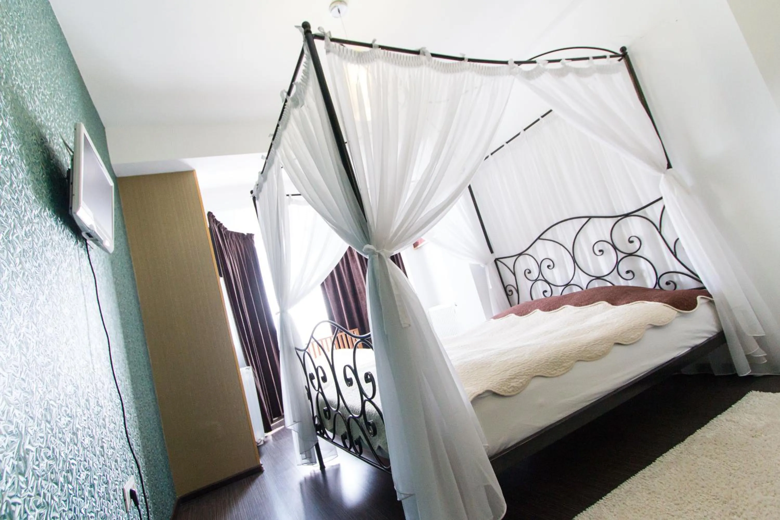 Bed in Hotel Jolie Apartments