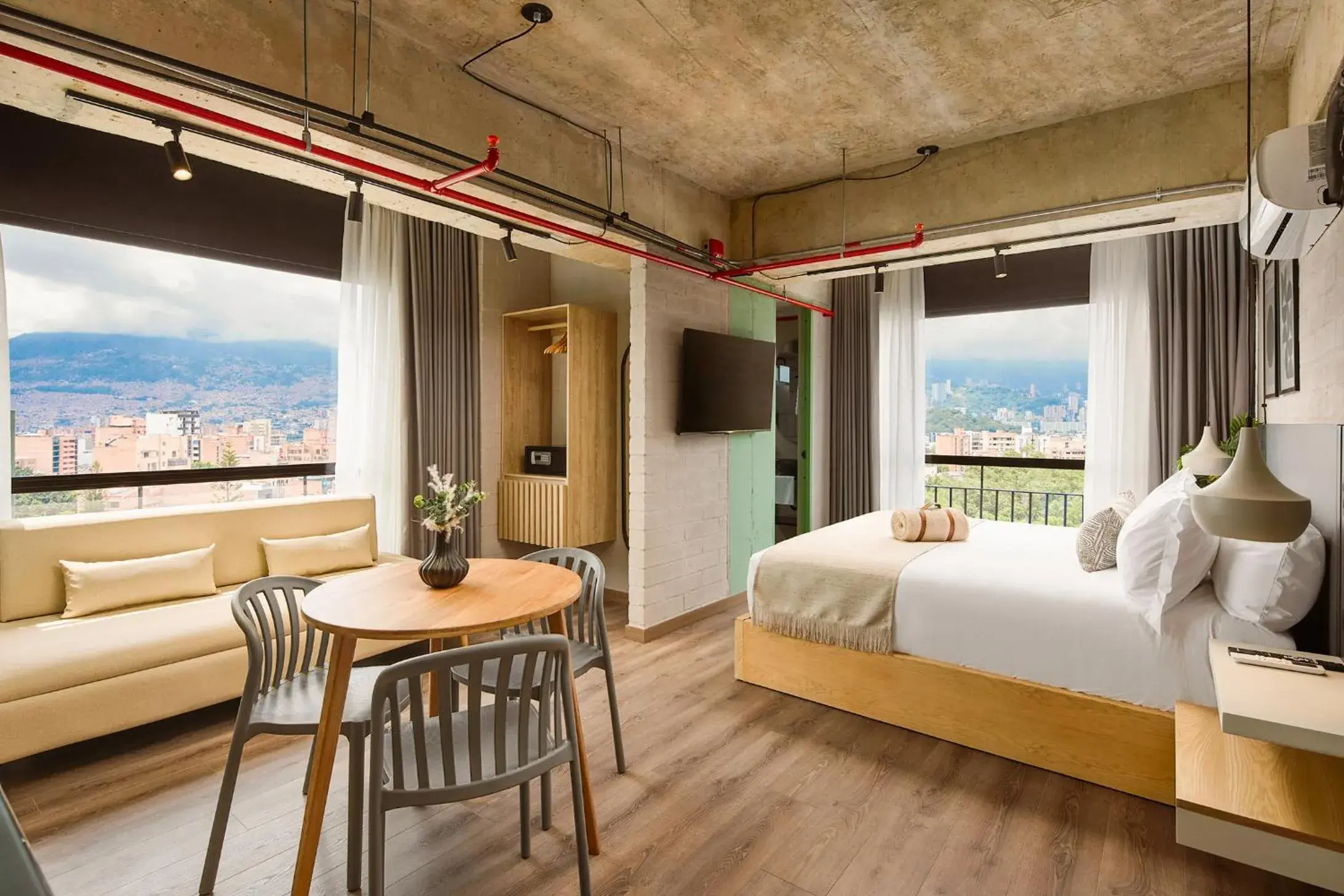 Communal lounge/ TV room, Bed in Urbit Social Lofts Communal lounge/ TV room, Bed in Urbit Social Lofts