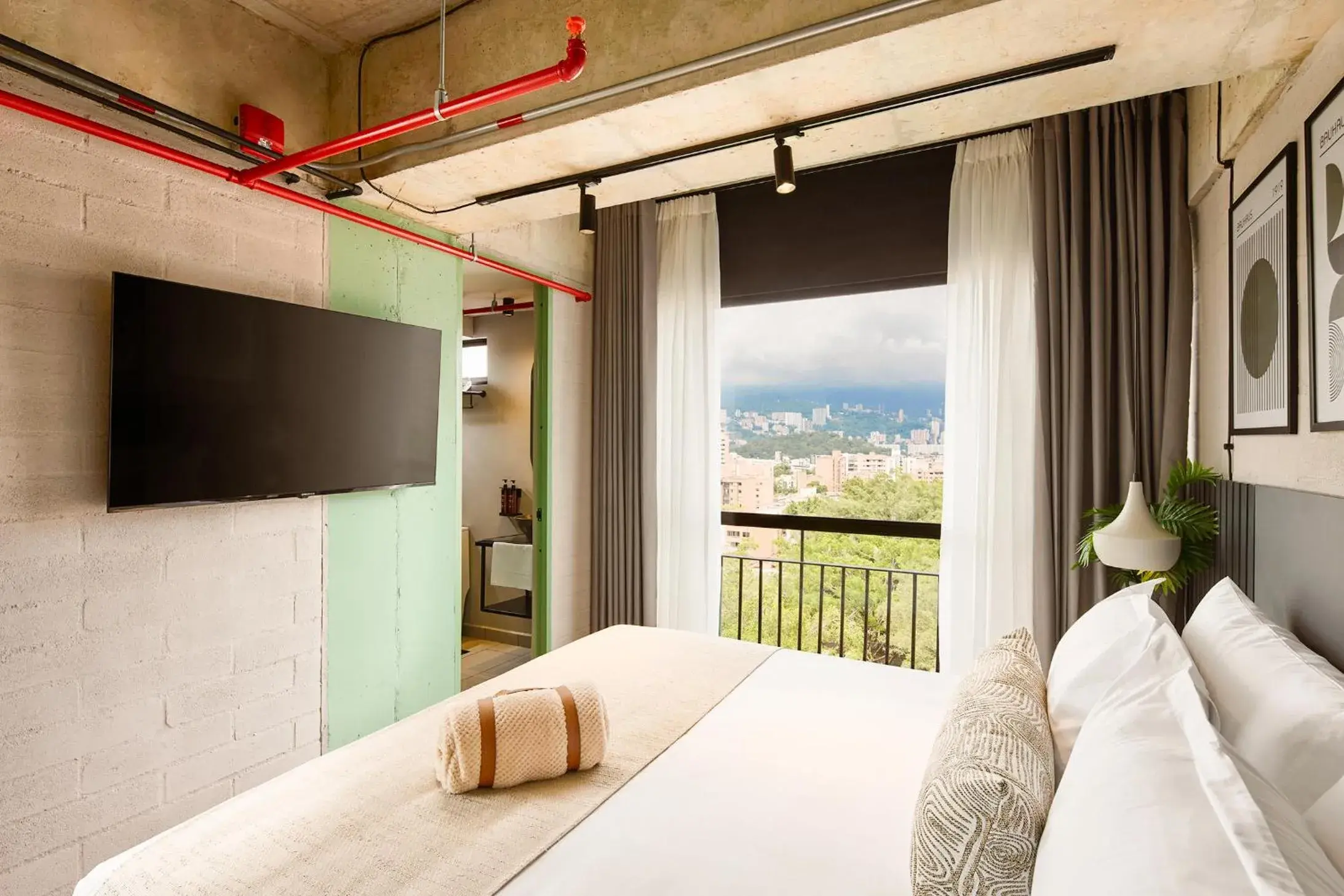 Communal lounge/ TV room, Bed in Urbit Social Lofts Communal lounge/ TV room, Bed in Urbit Social Lofts