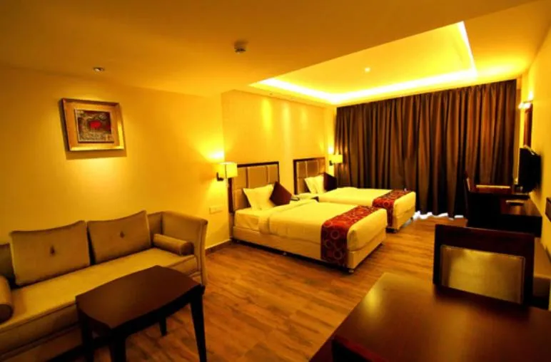 Bed in Paravoor Galaxy Hotel