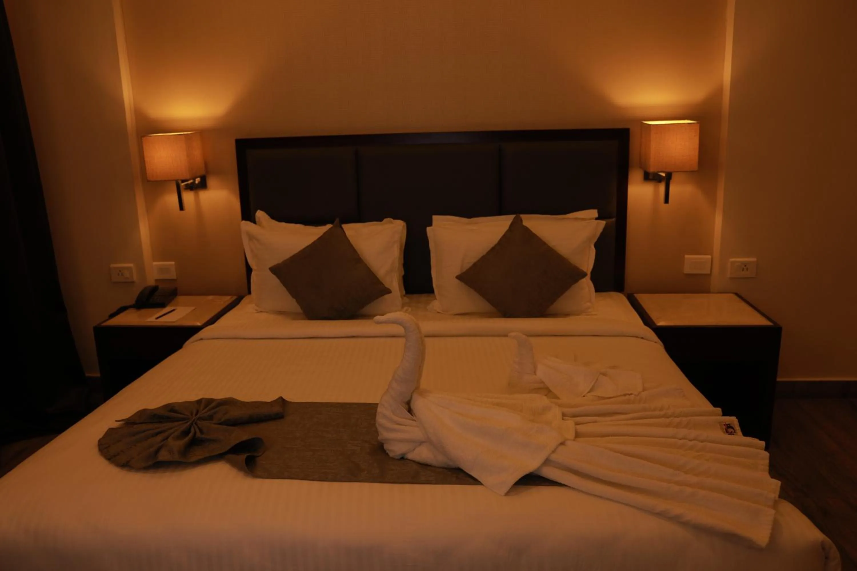 Bed in Paravoor Galaxy Hotel