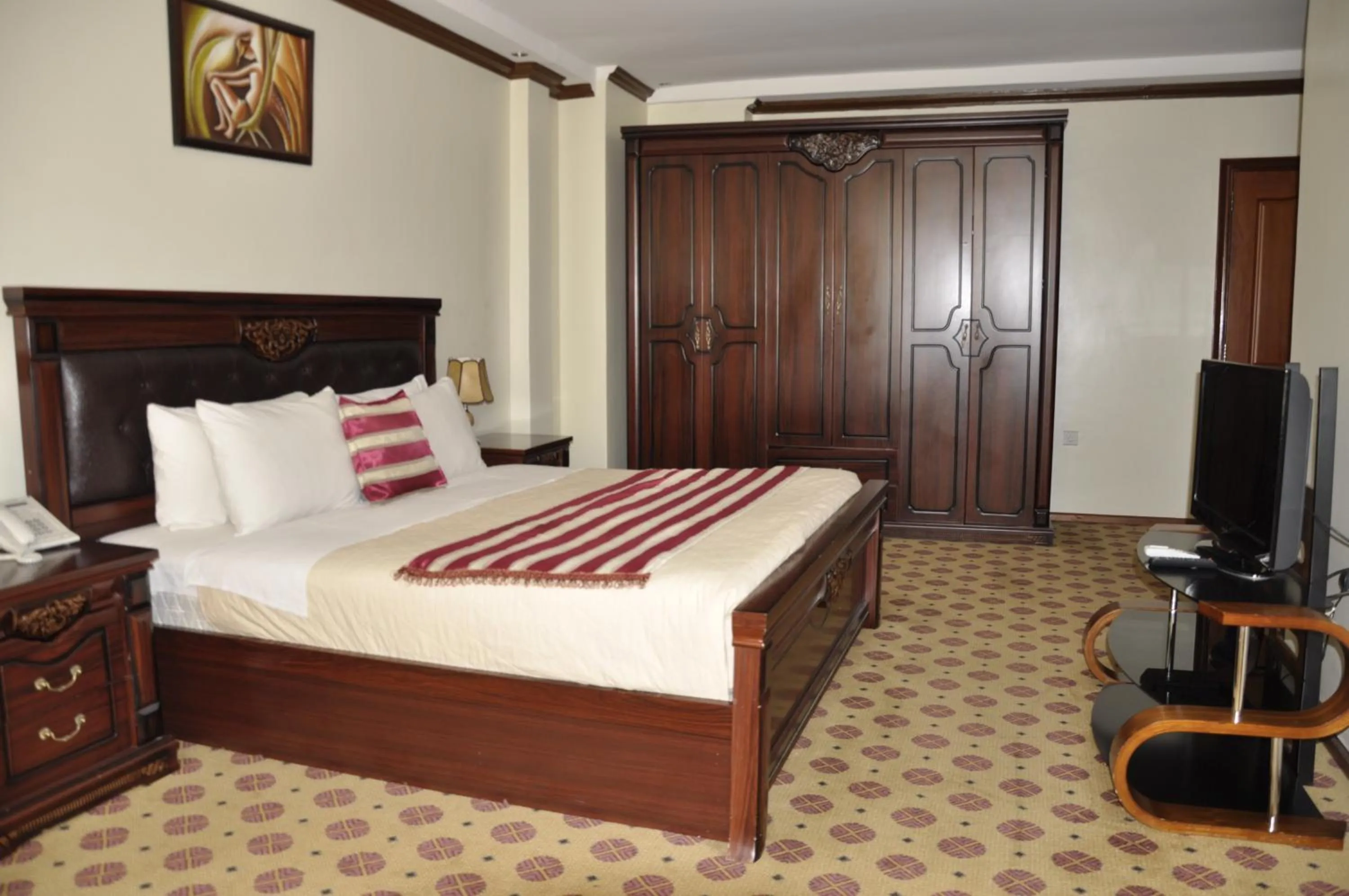 Bed in Hotel Karisimbi