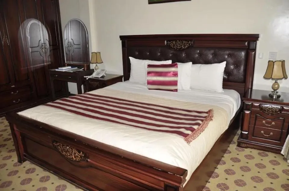 Bed in Hotel Karisimbi