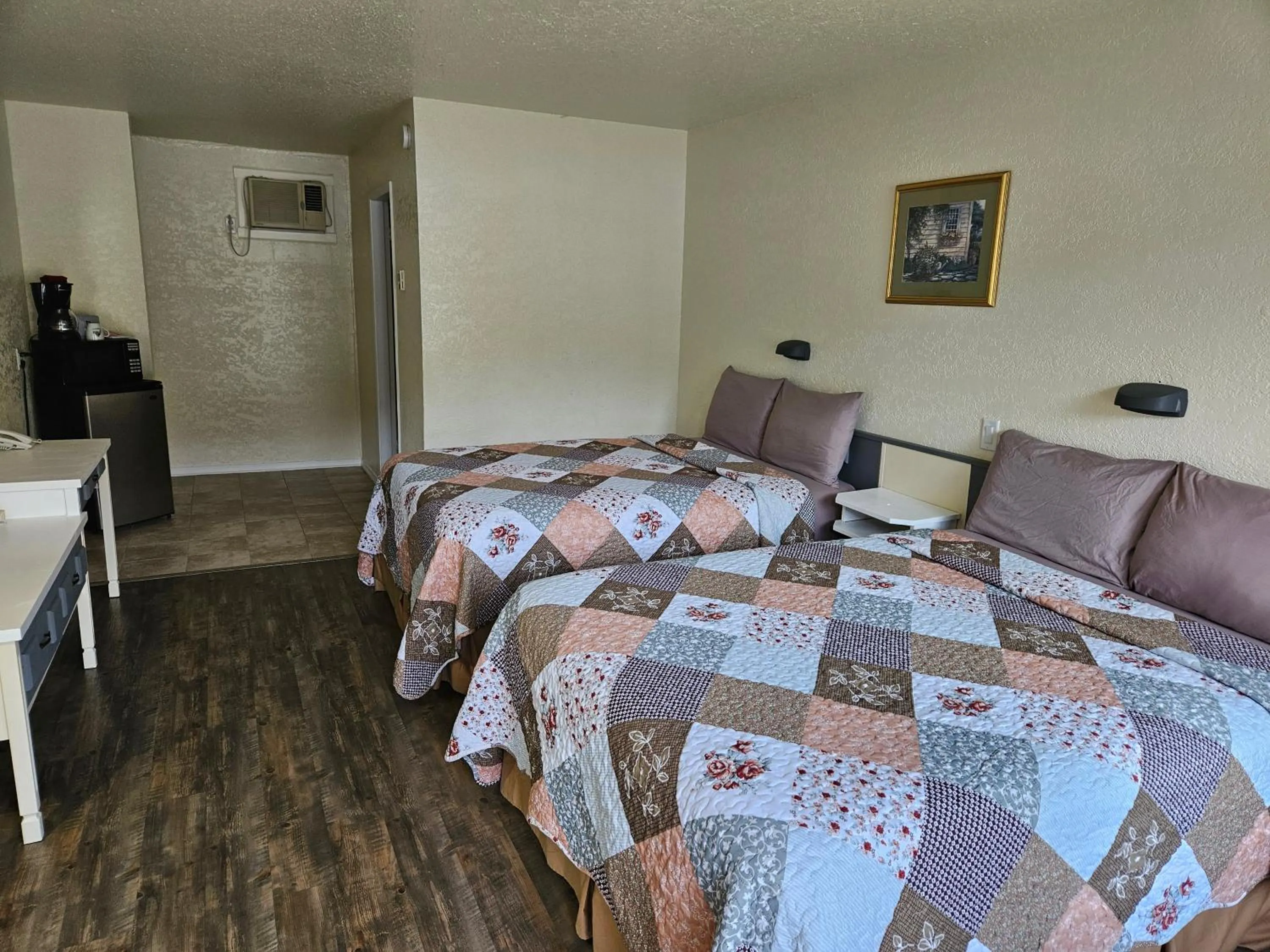 Bed in Granby River Inn & Suites