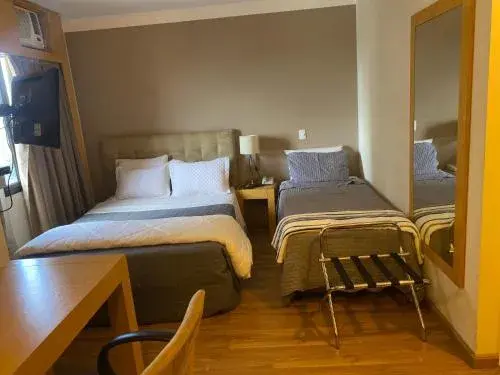 Quarto triplo em Congonhas Quarto triplo em Congonhas