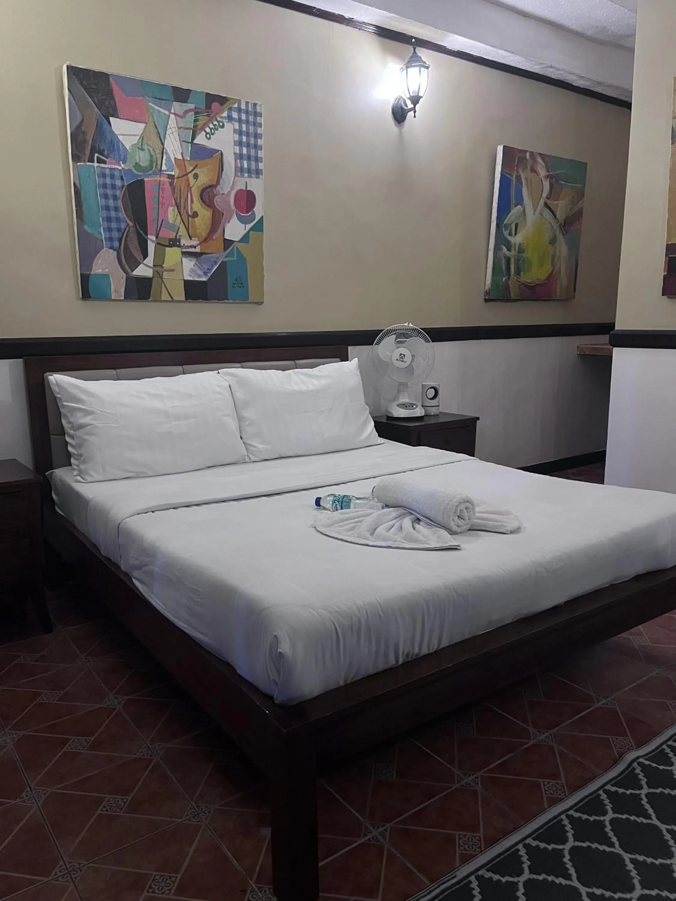 Bed in Big Apple Dive Resort