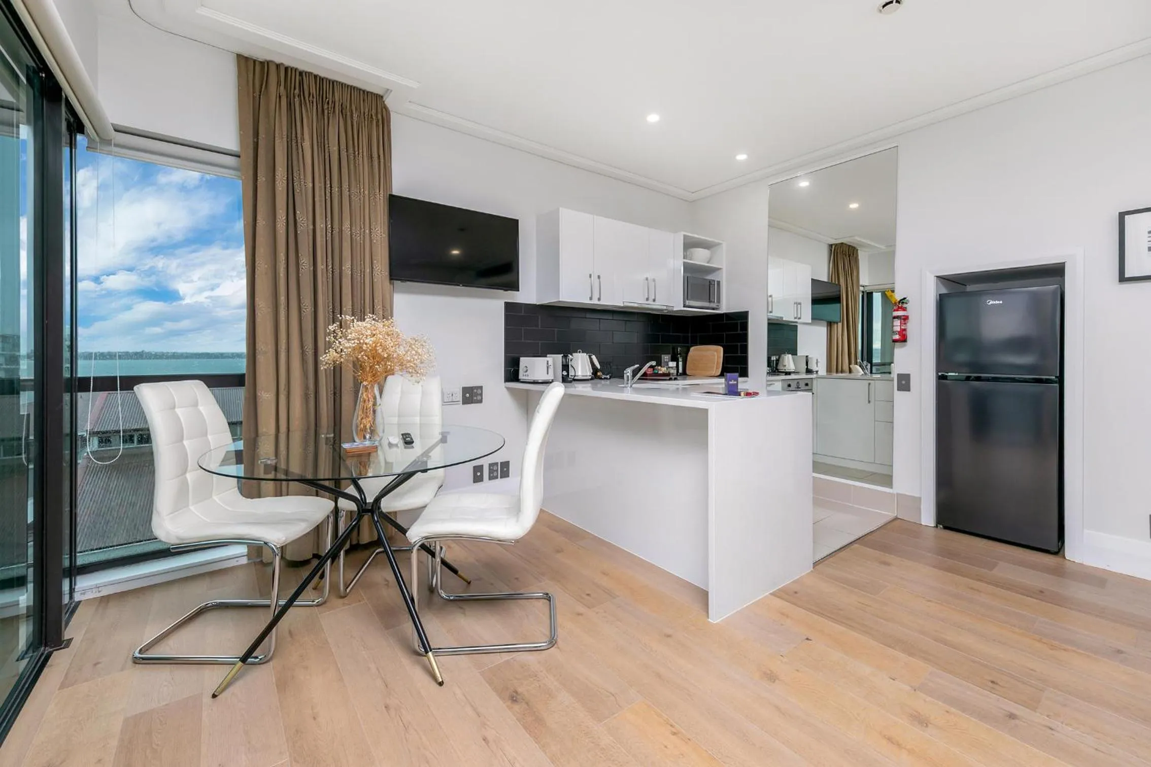 Dining area in Exquisite Sun Soaked Corner Apartment