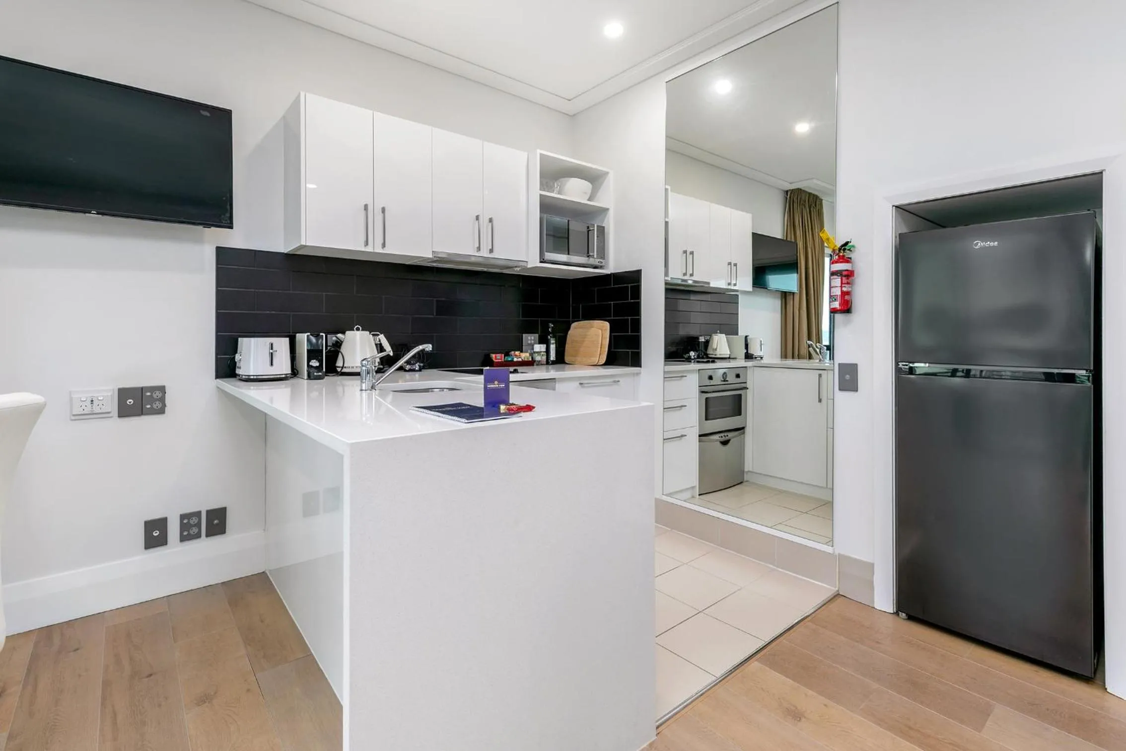 kitchen in Exquisite Sun Soaked Corner Apartment