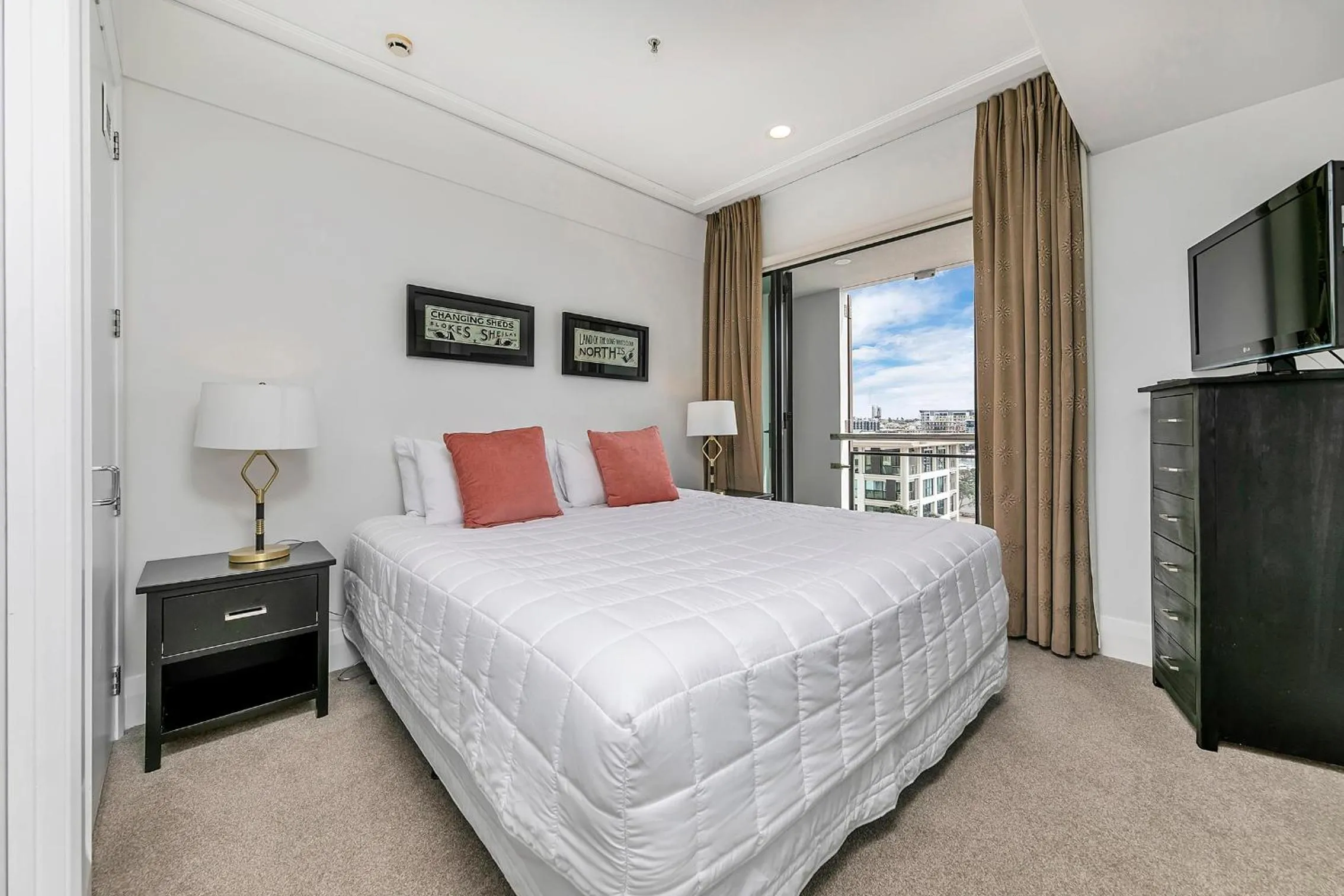 Bed in Exquisite Sun Soaked Corner Apartment
