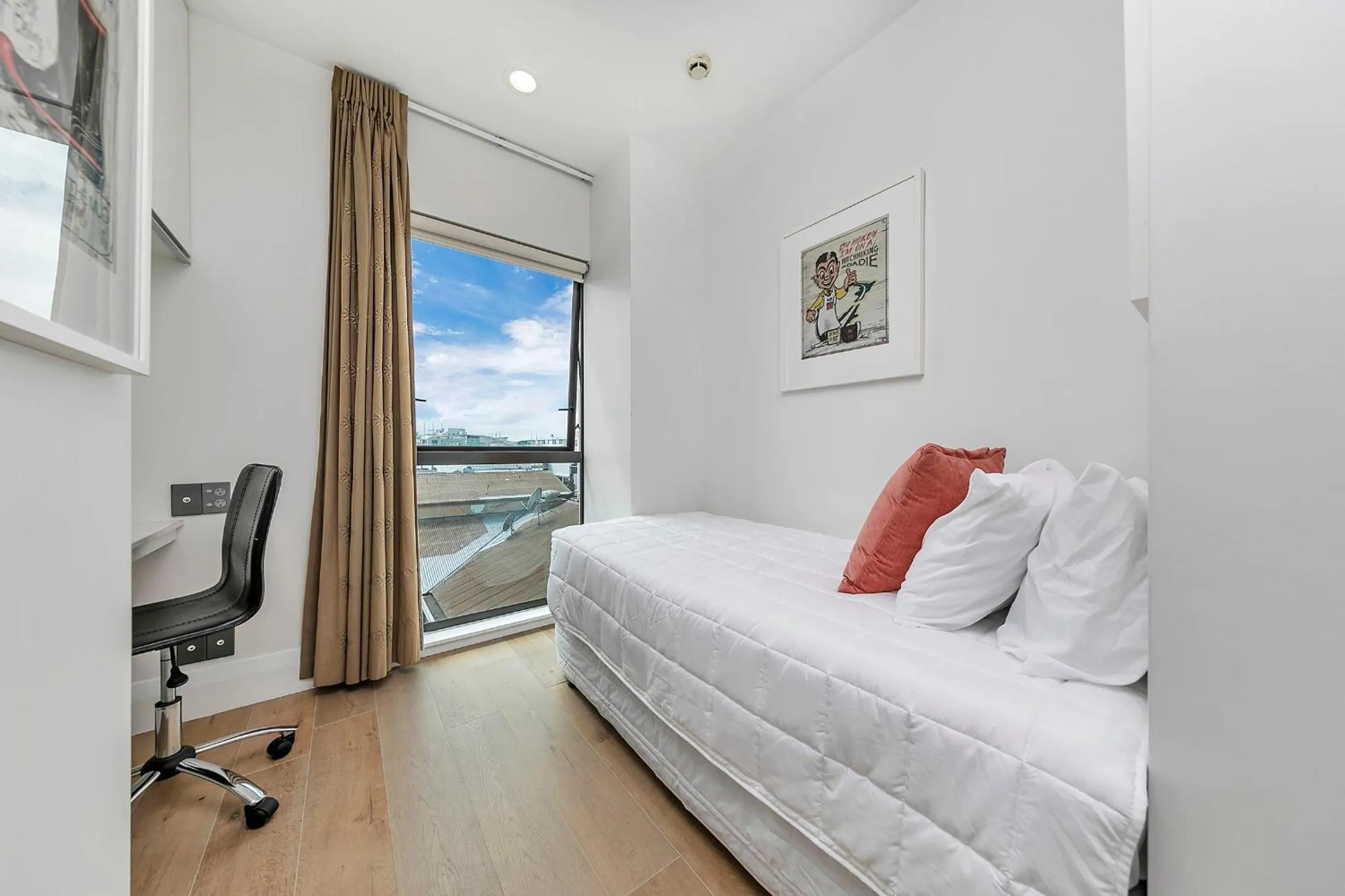 Bed in Exquisite Sun Soaked Corner Apartment