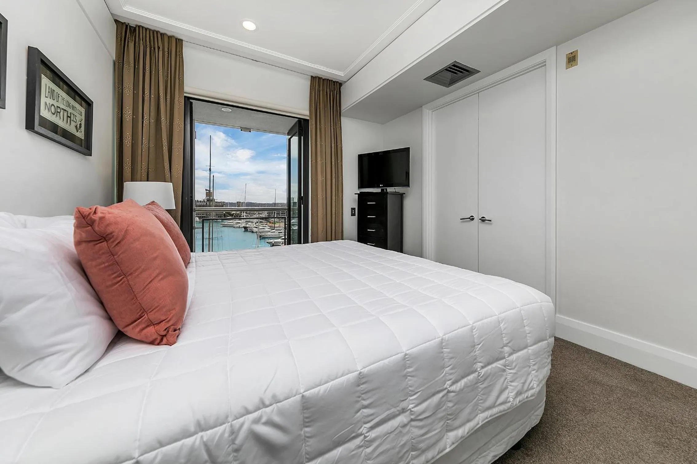 Bed in Exquisite Sun Soaked Corner Apartment