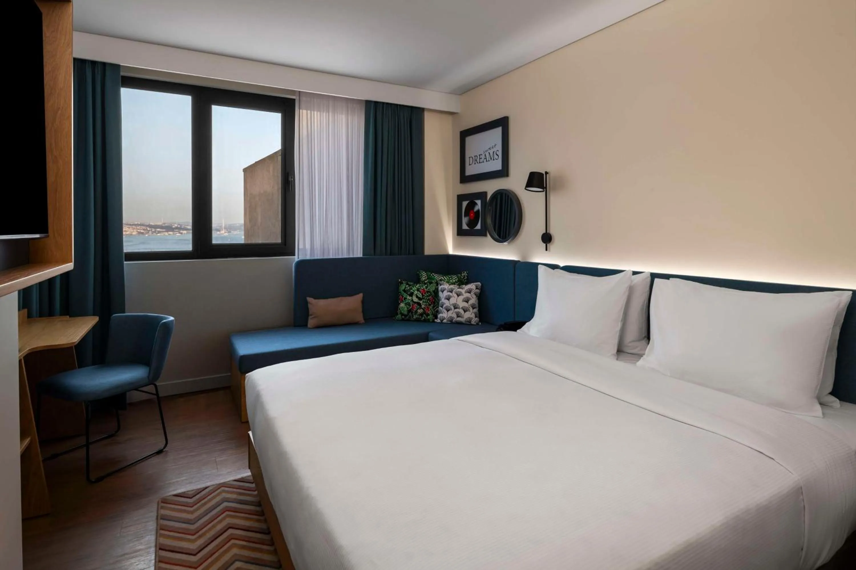 Living room, Bed in Hampton By Hilton Istanbul Sirkeci