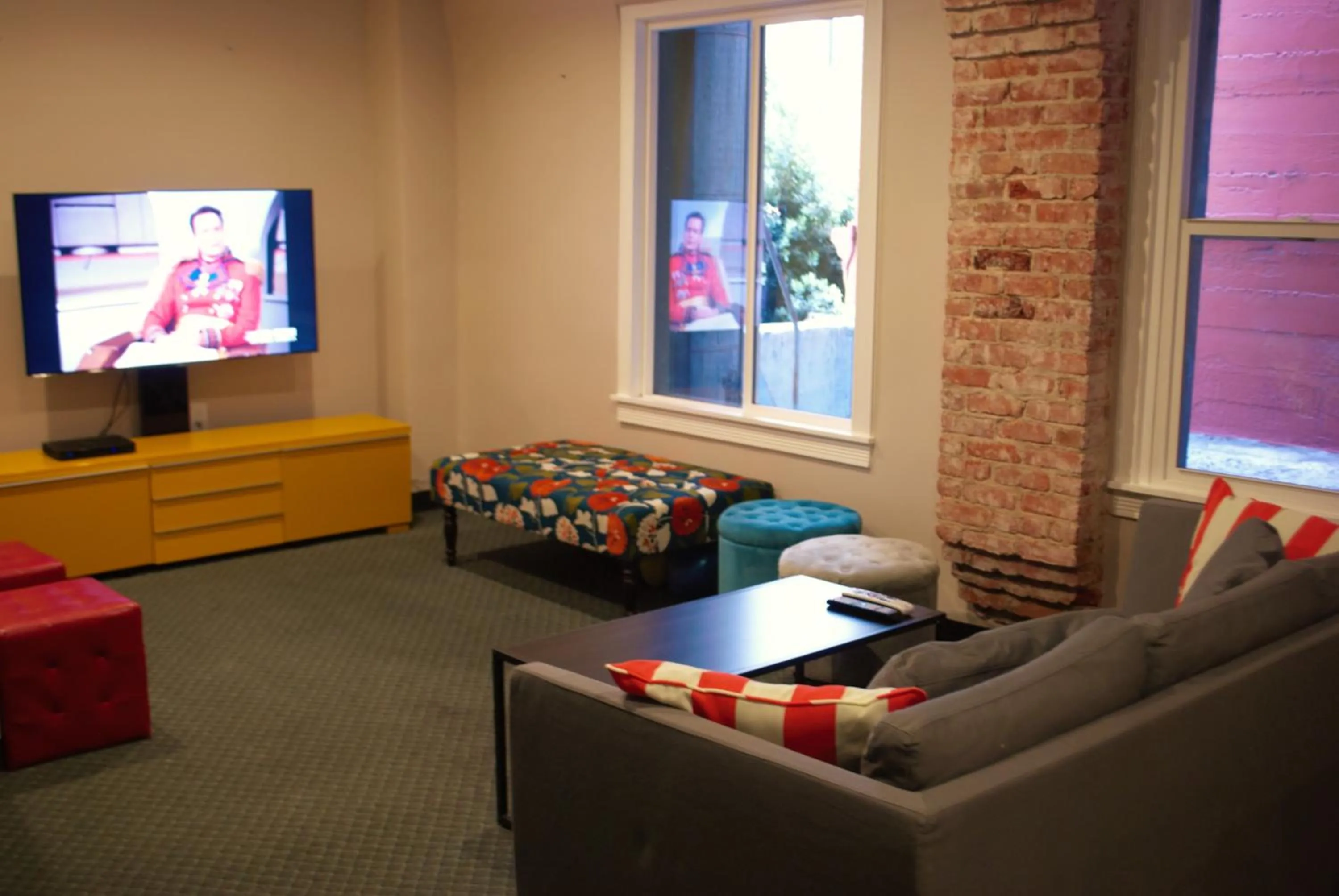 Communal lounge/ TV room in Orange Village Hostel