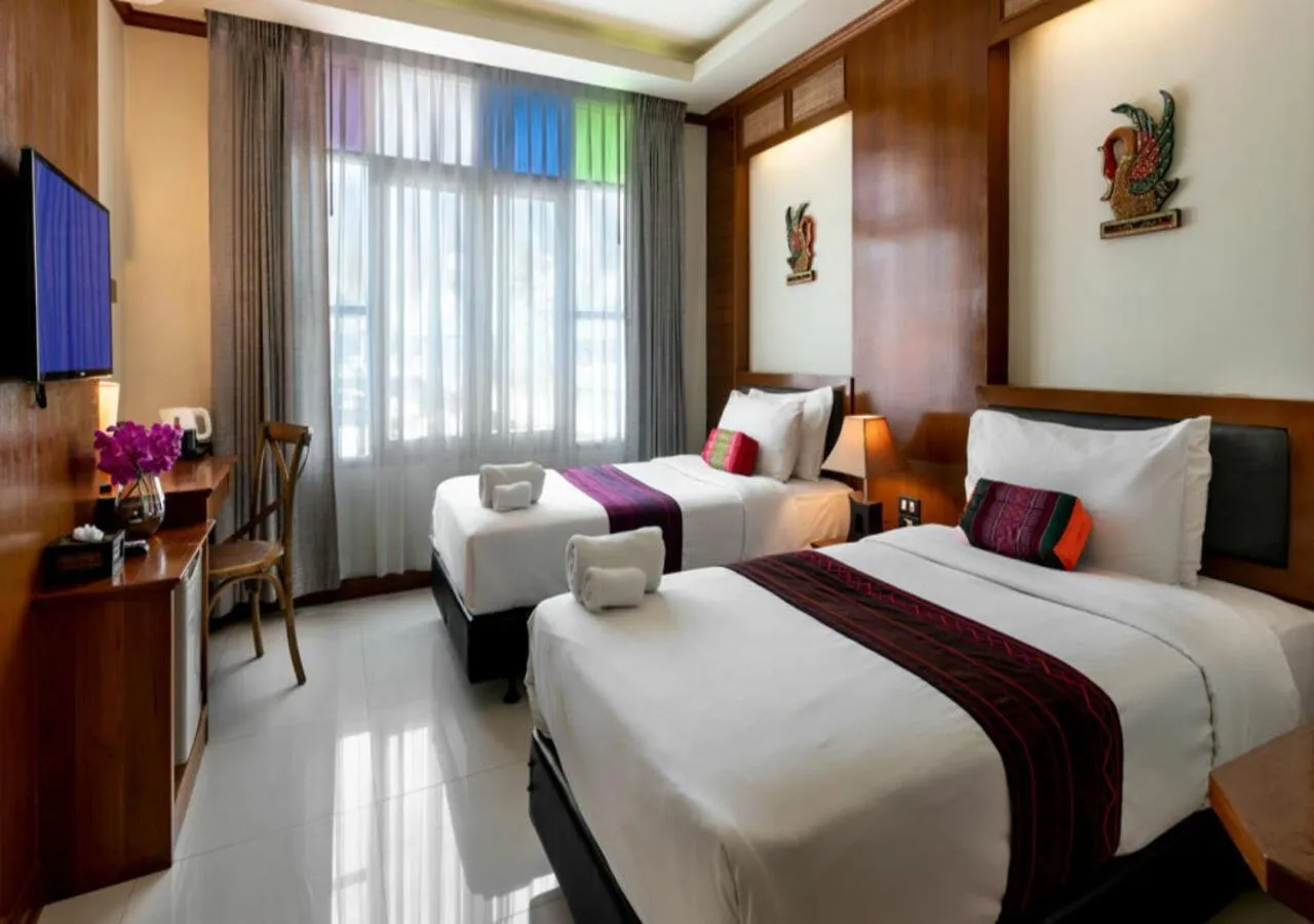 Bed in Lee Chiang Hotel