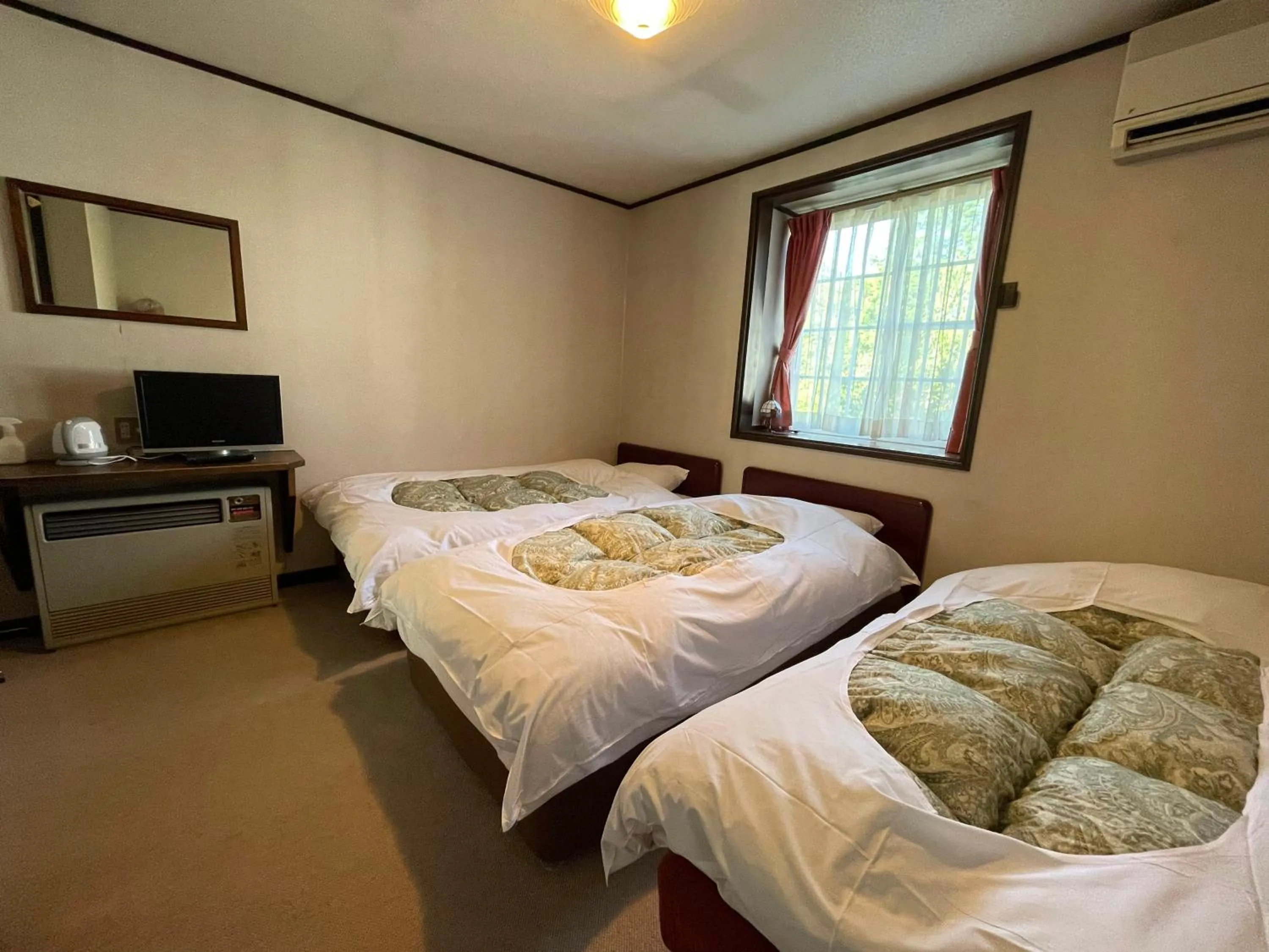 Bed in Hotel Sejour Mint in Hakuba