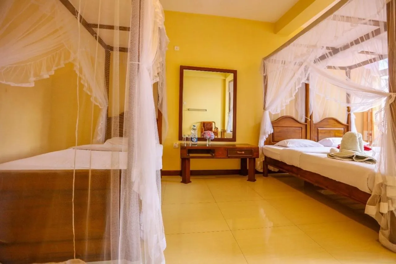 Bed in Srilak View Holiday Inn