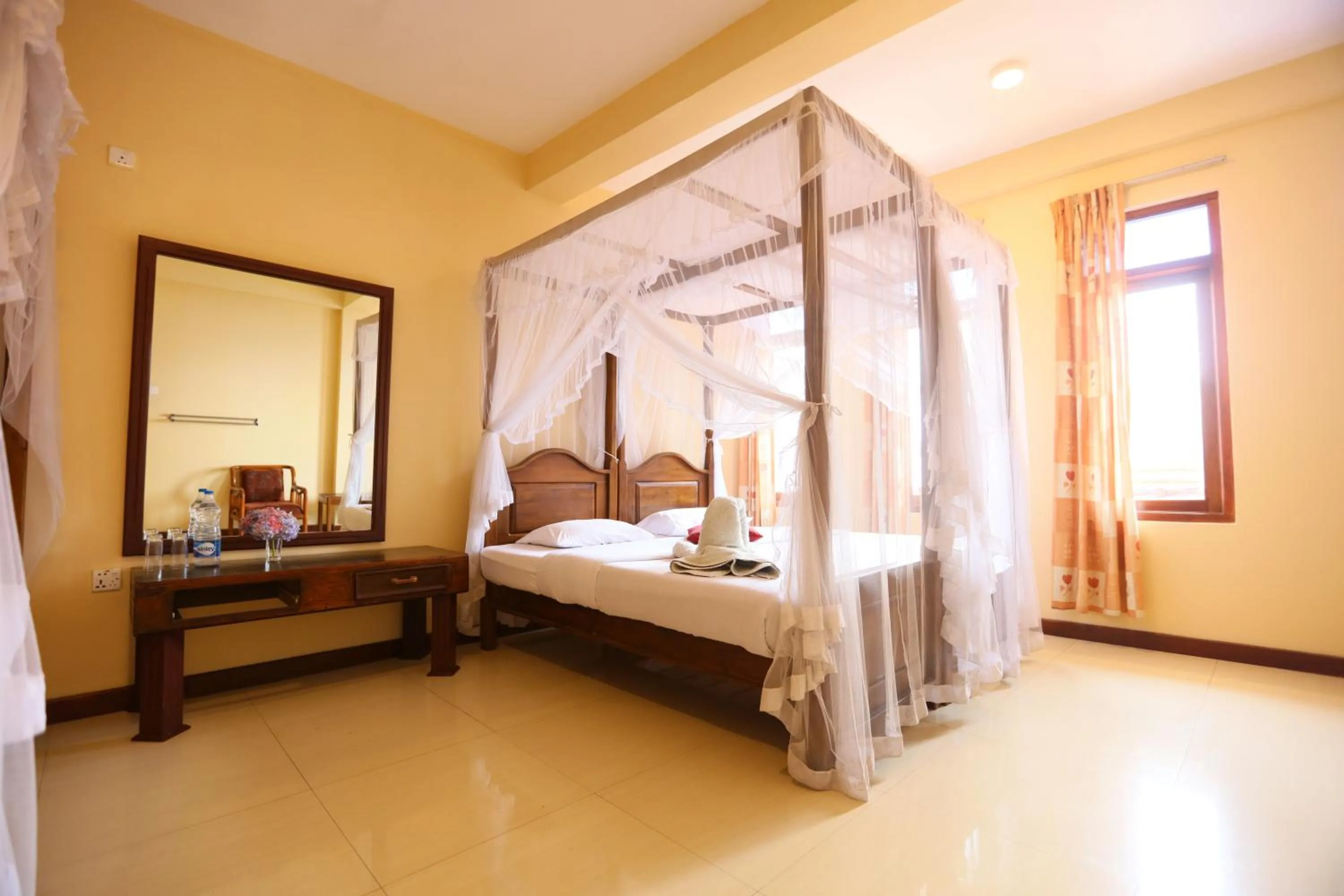 Bed in Srilak View Holiday Inn