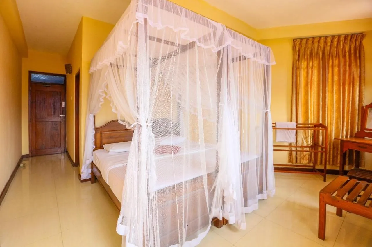 Bed in Srilak View Holiday Inn