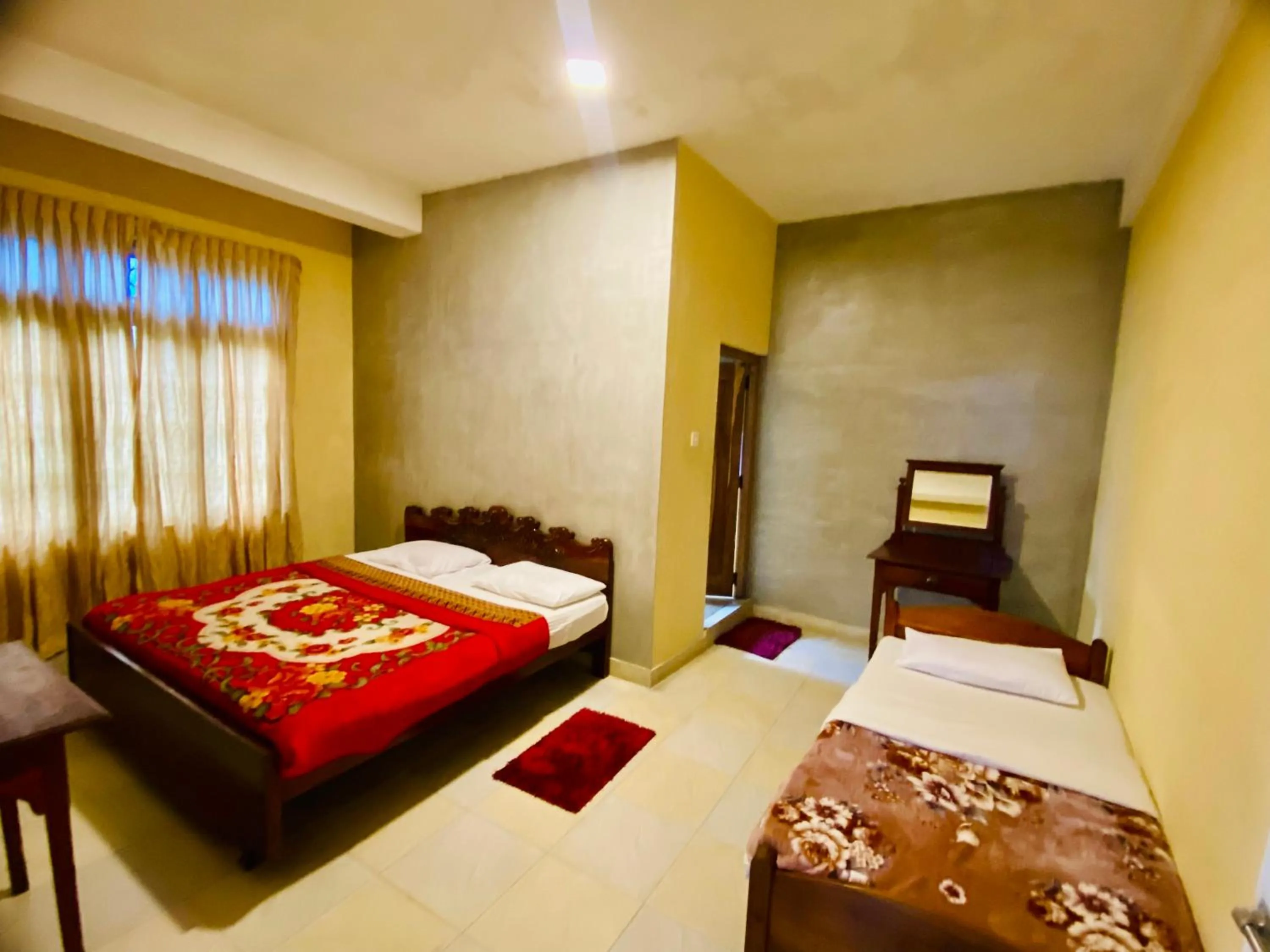 Bed in Srilak View Holiday Inn