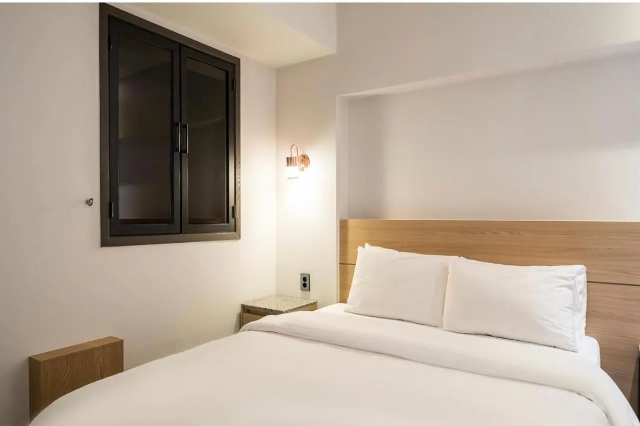 Bed in HOTEL MYEONG JAK