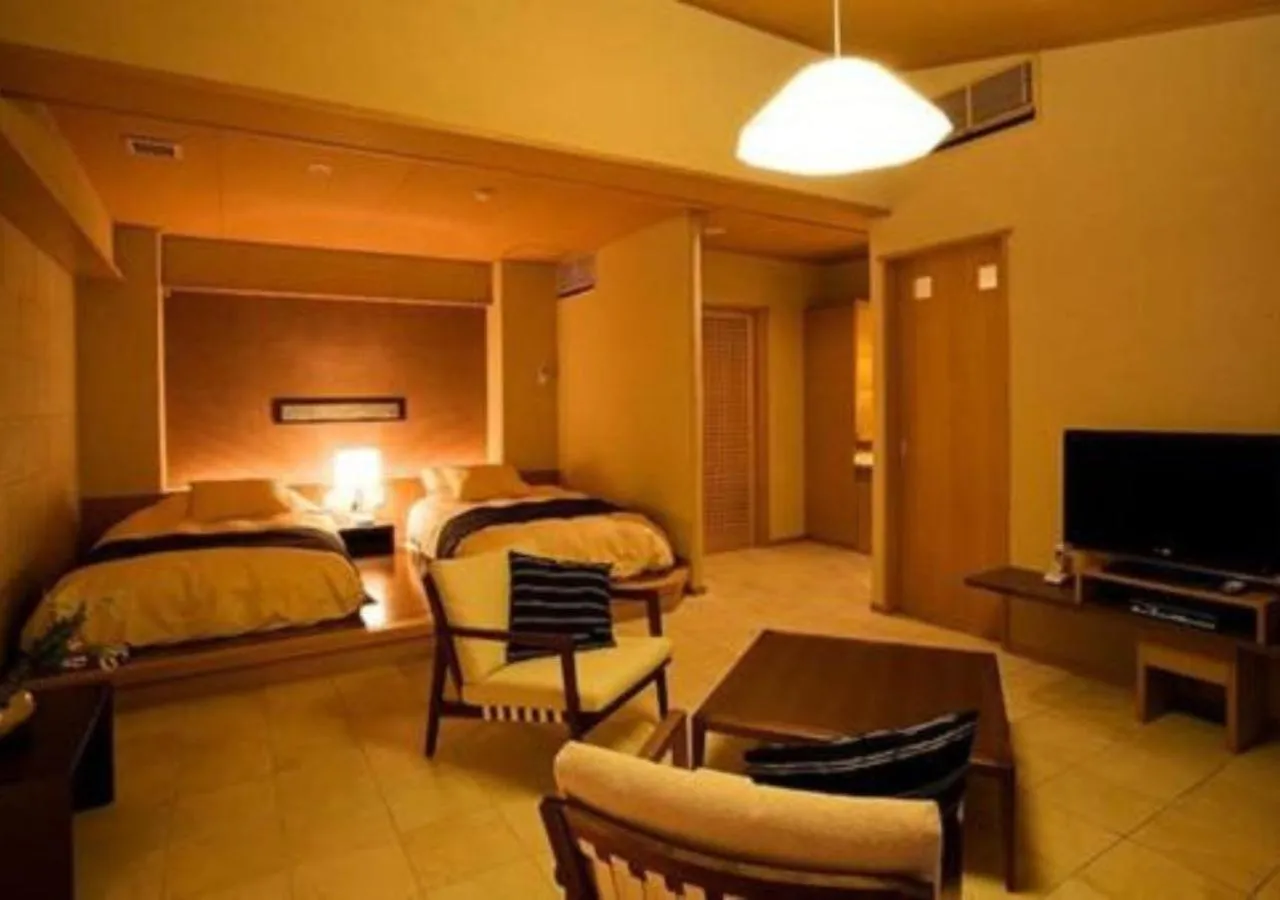 Living room, Bed in Oyado The Earth