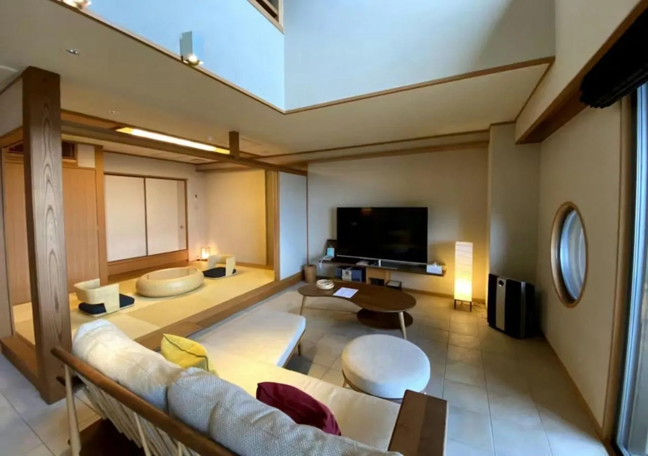 Living room, Bed in Oyado The Earth