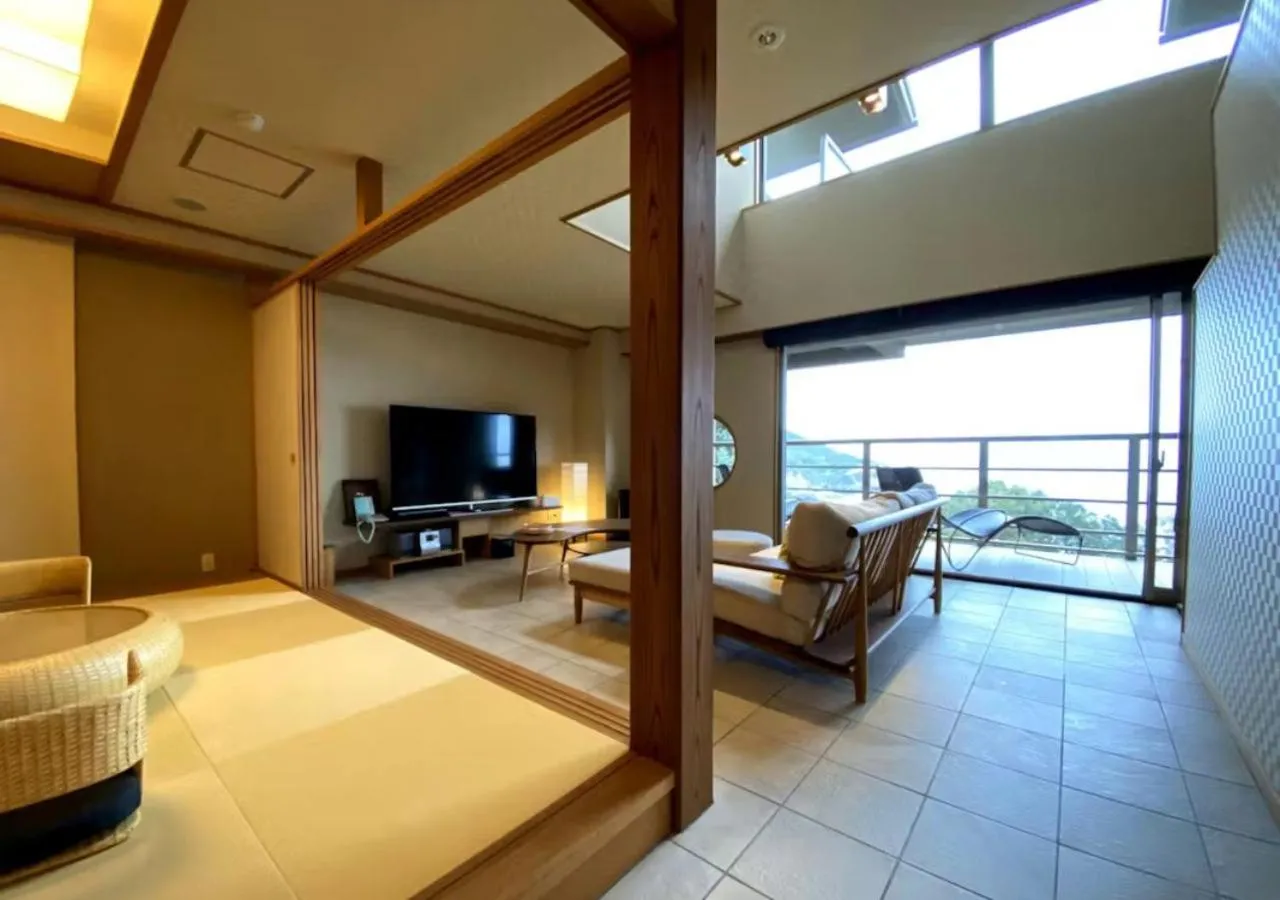 Living room, Bed in Oyado The Earth