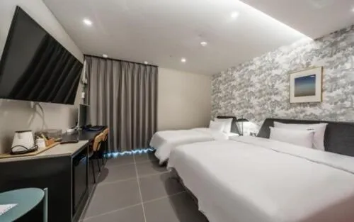 Bed in Brown Dot Hotel Sajik Baseball Stadium