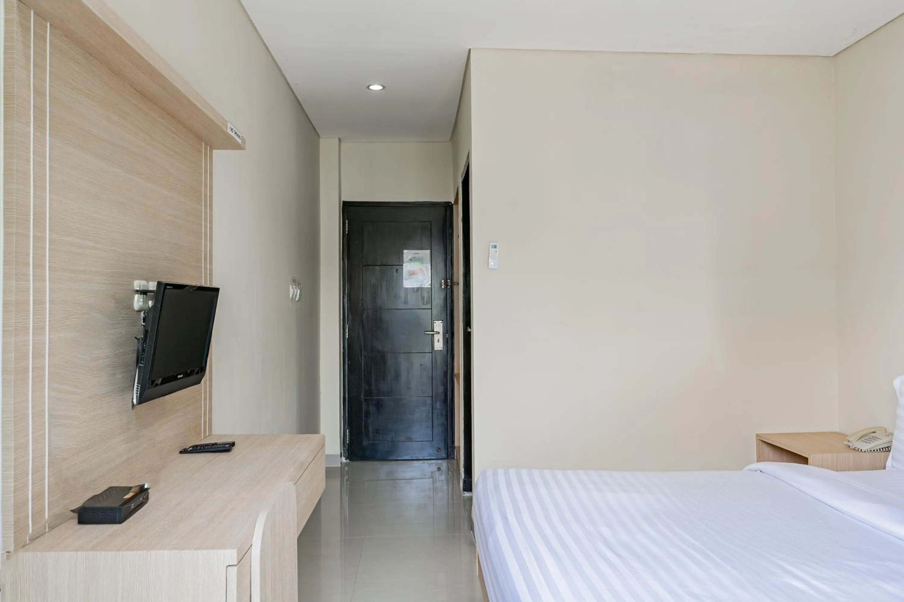 Photo of the whole room, Bed in Collection O Kuta Near Airport Ngurah Rai