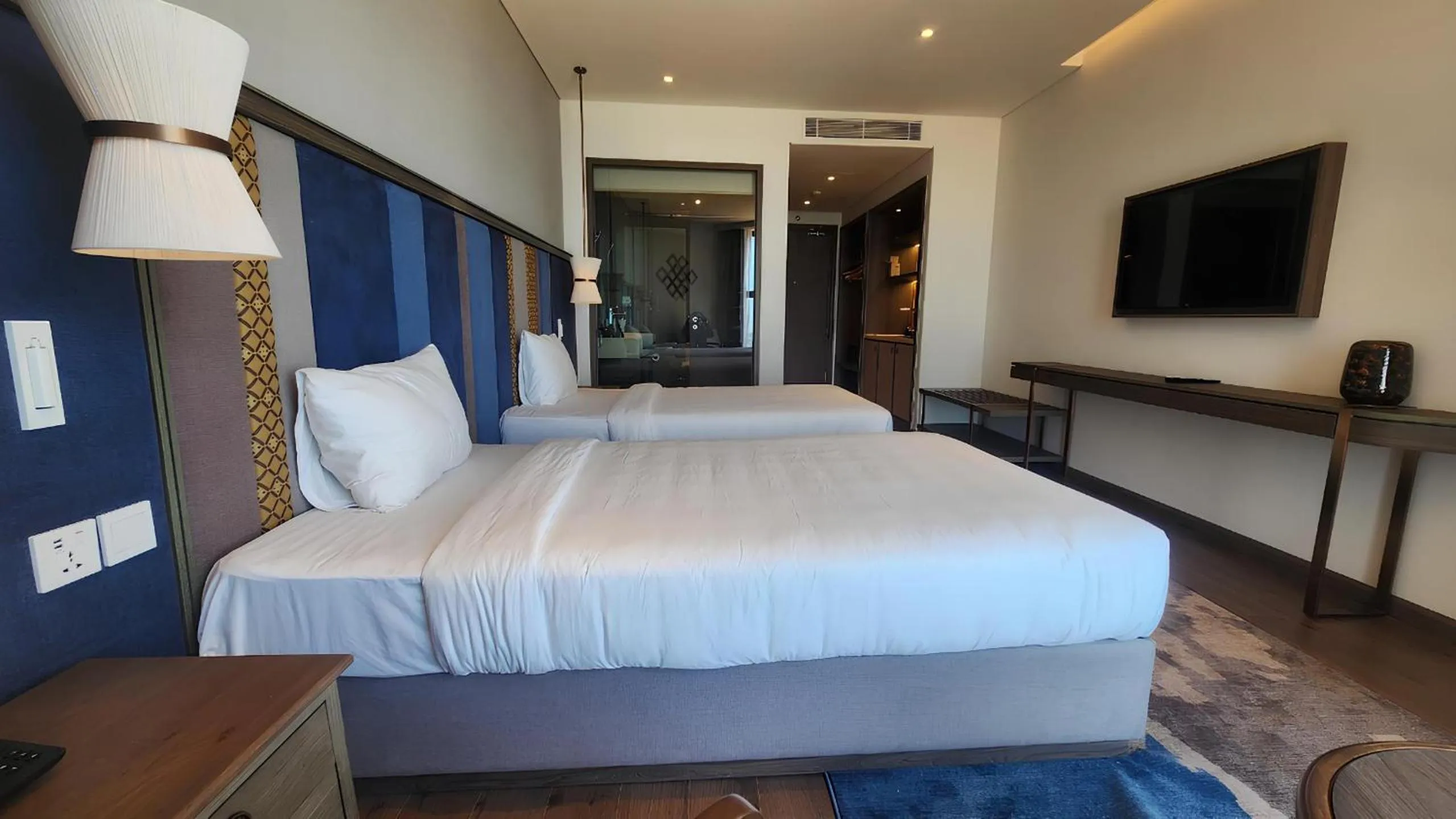 Bed in Apec Luxe Escape Sunset Resort