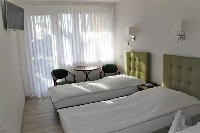 Bed in Hotel Zielony & OW Borowik & Pensjonat Manhattan - Centrum Rekreacji i Wypoczynku GASTROTUR