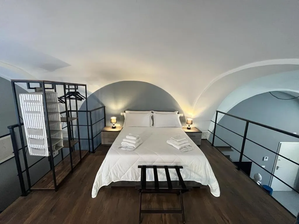 Bed in San Giacomo Loft Apartment